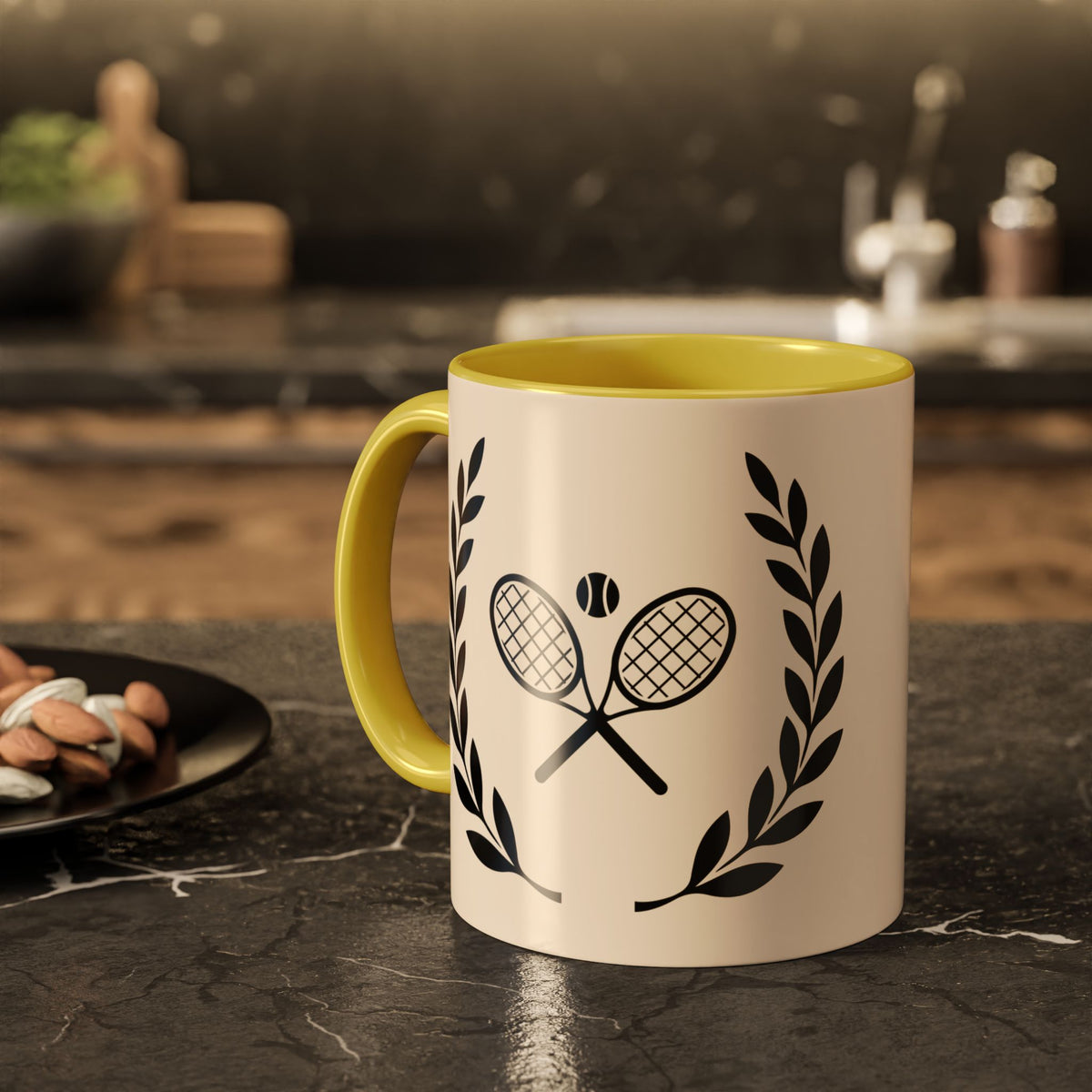 Tennis Coffee Mug A ceramic mug with a yellow handle and interior, featuring a black tennis racket and laurel wreath graphic on a cream-colored exterior, set on a dark kitchen countertop.