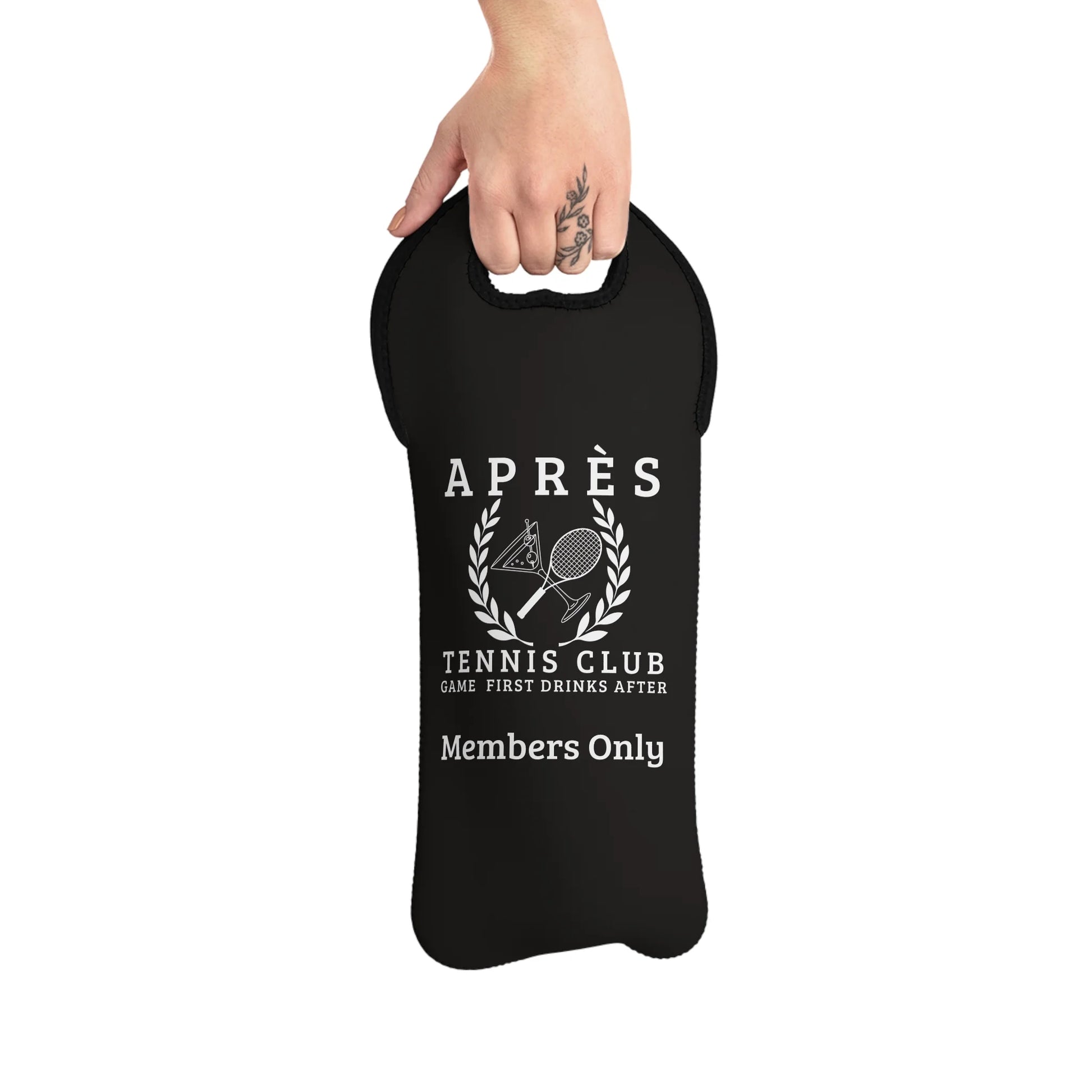 Wine tote bag Black bag with white text and graphics, held by a hand on a white background