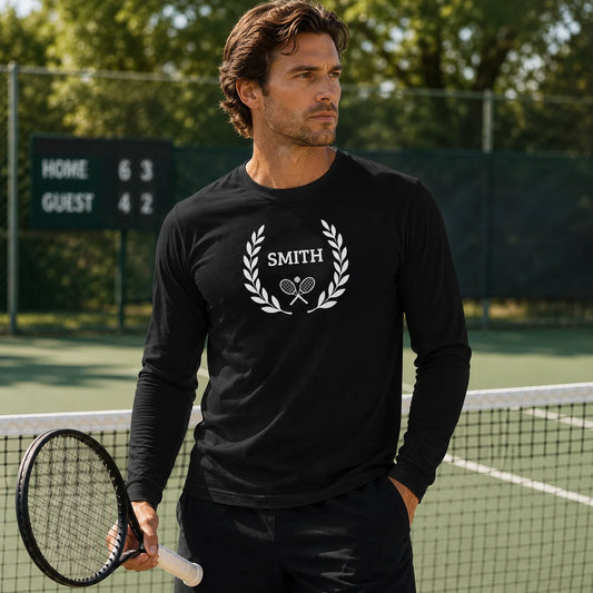 long sleeve tennis shirt Man on a tennis court wearing a black long-sleeve shirt with 'Smith' logo, holding a tennis racket.