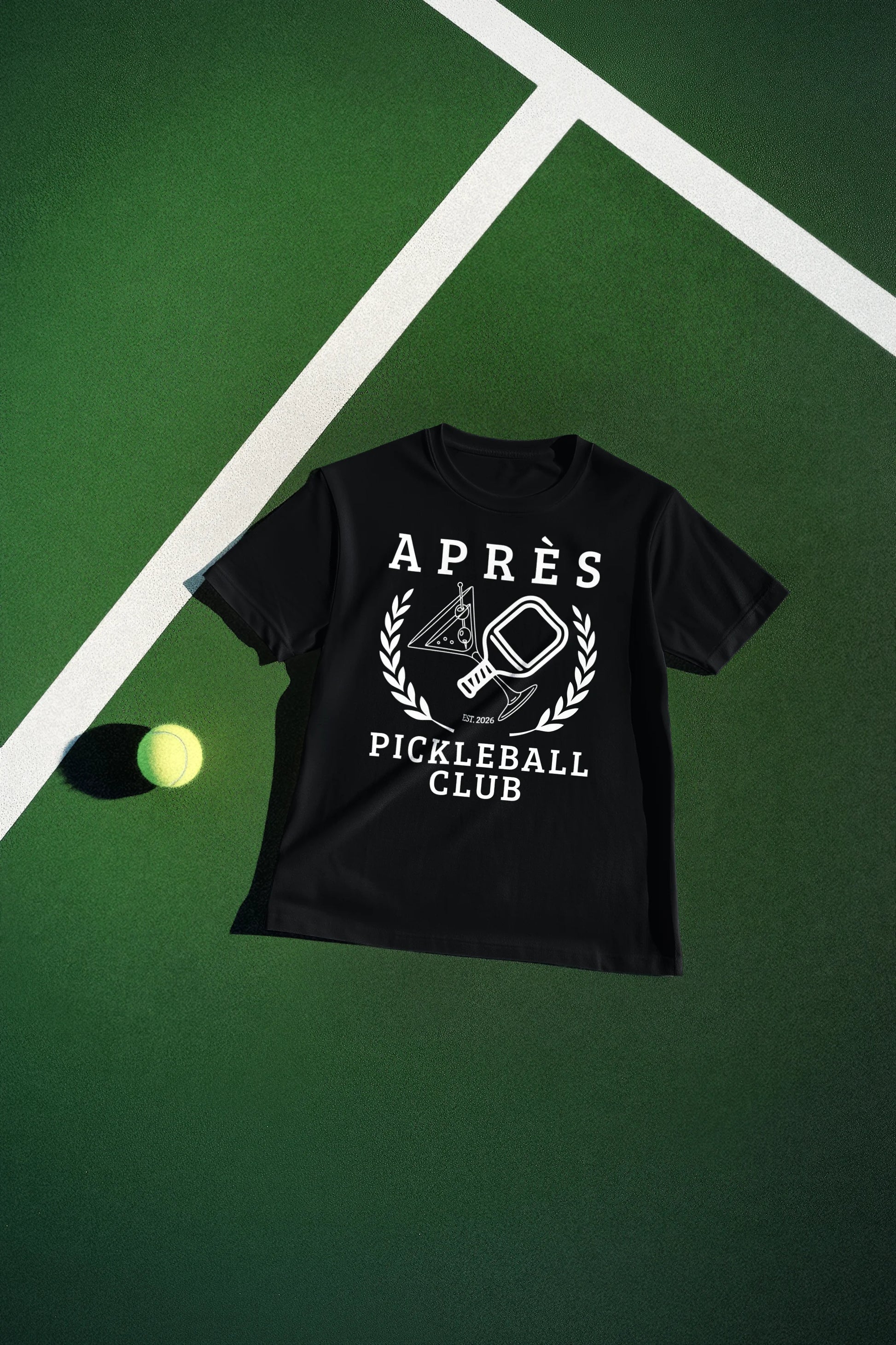 Funny Pickleball Shirt Black t-shirt with 'Apres Pickleball Club' design on a green surface
