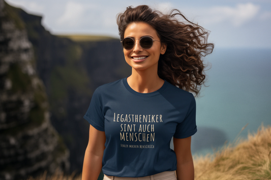 Woman wearing a blue t-shirt with text outdoors