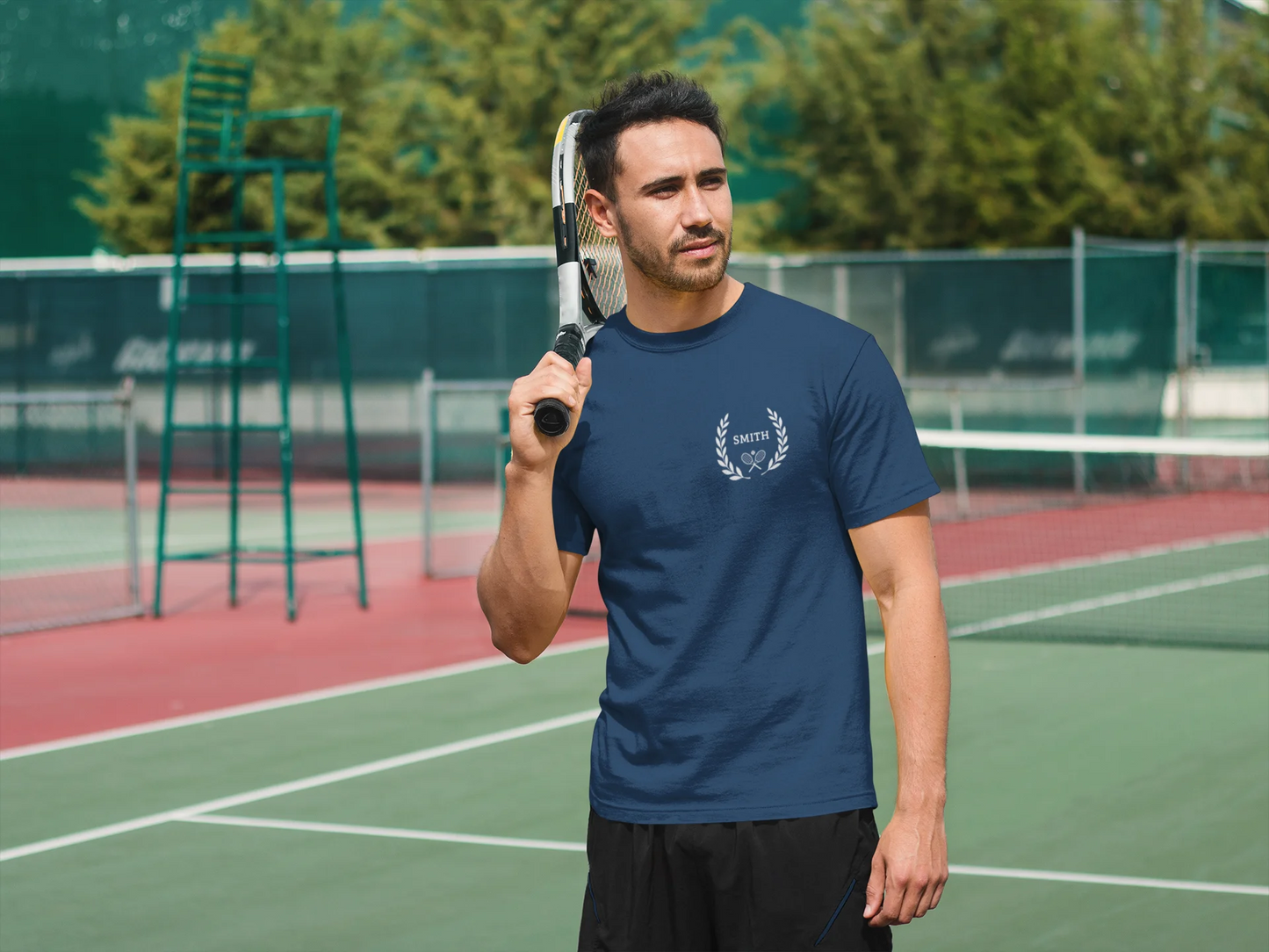 Unique gifts for tennis players Man holding a tennis racket on a tennis court with trees in the background