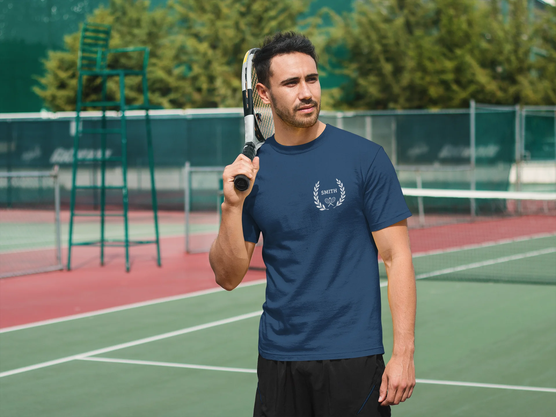 Unique gifts for tennis players Man holding a tennis racket on a tennis court with trees in the background