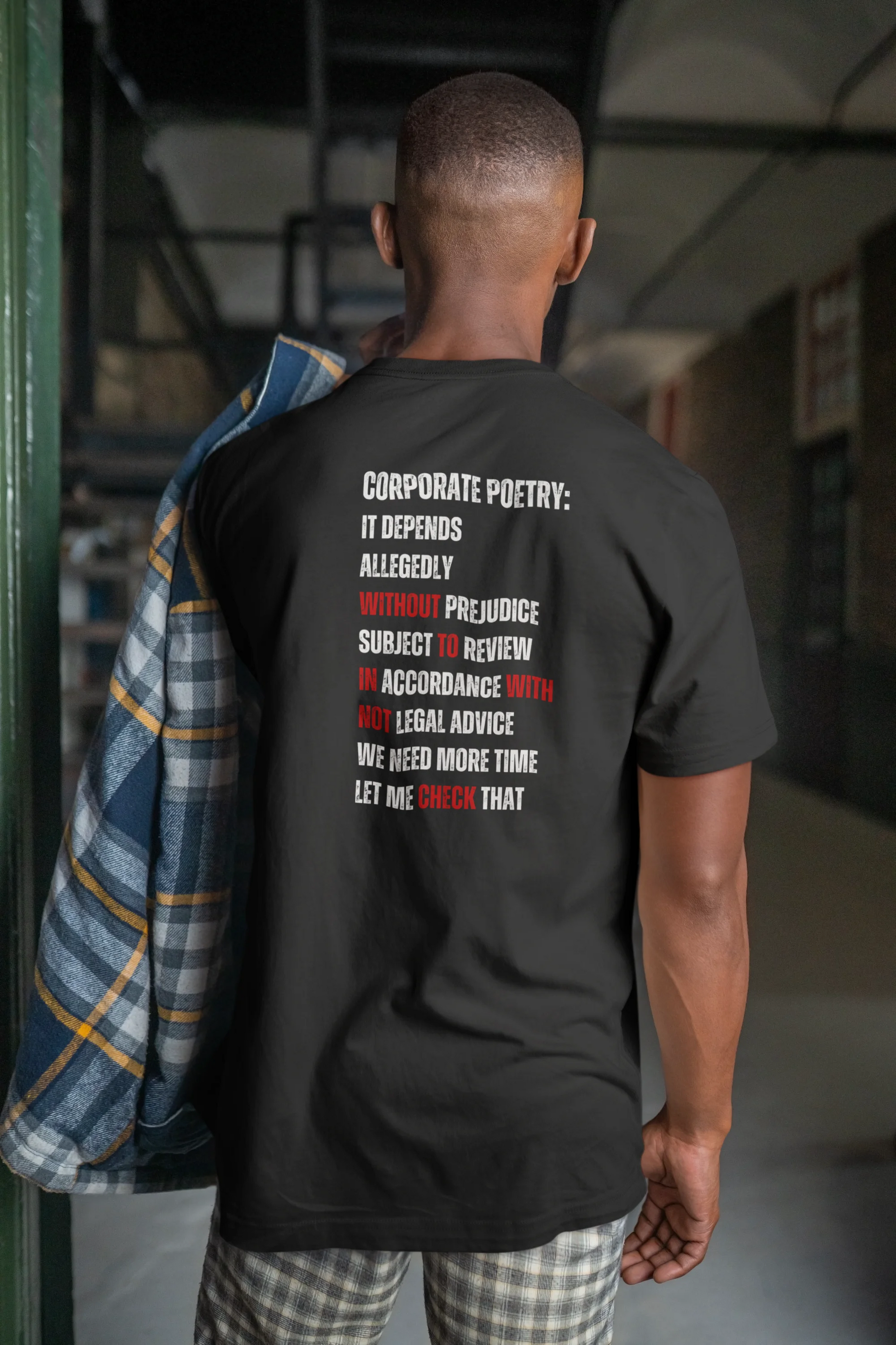Funny Lawyer Shirt Person wearing a black t-shirt with text on the back in an indoor setting