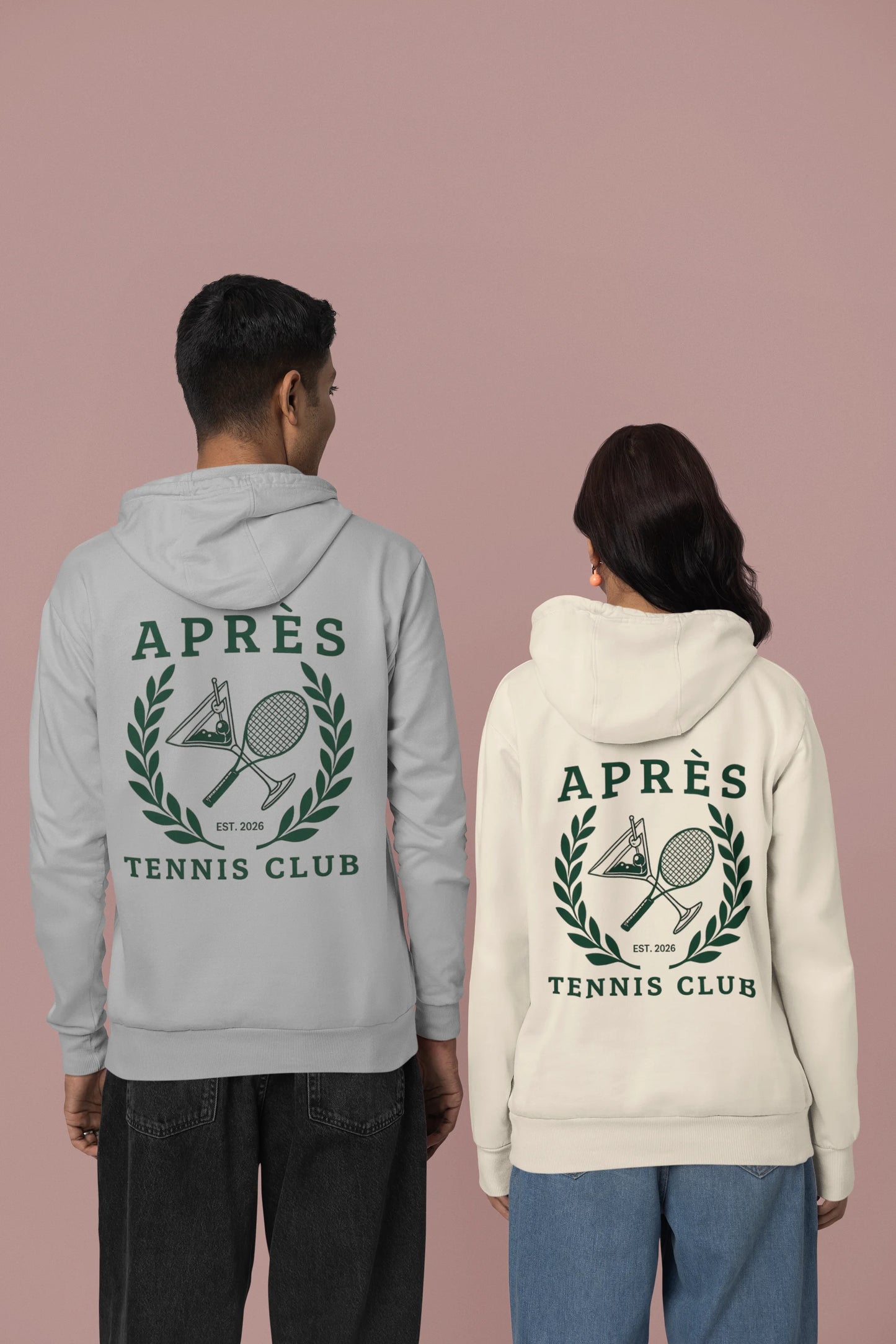 Tennis Hoodie Two people wearing hoodies with 'APRèS Tennis Club' design on a pink background