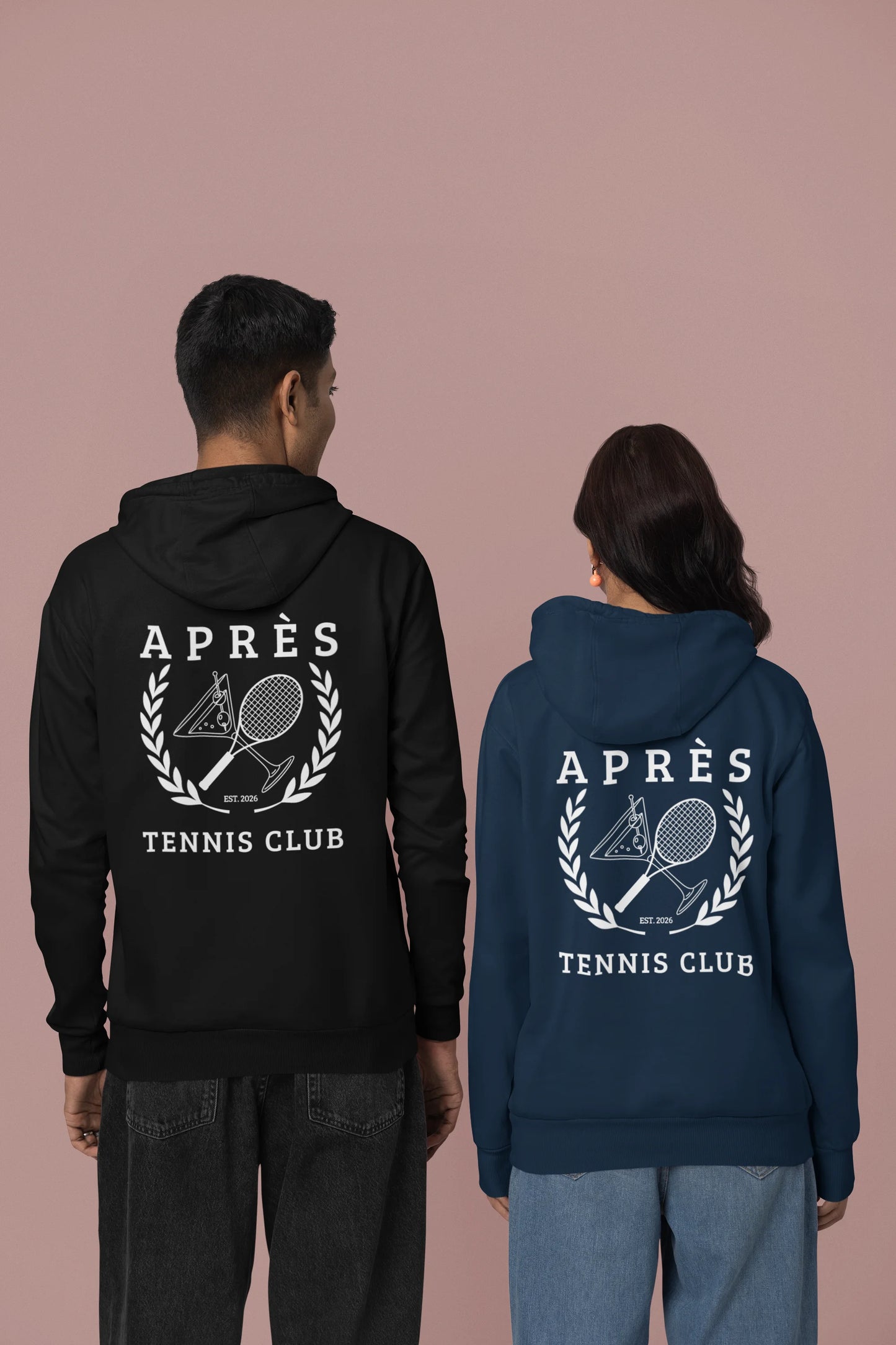 Tennis Club Hoodie Two people wearing hoodies with 'APRèS Tennis Club' design on a beige background
