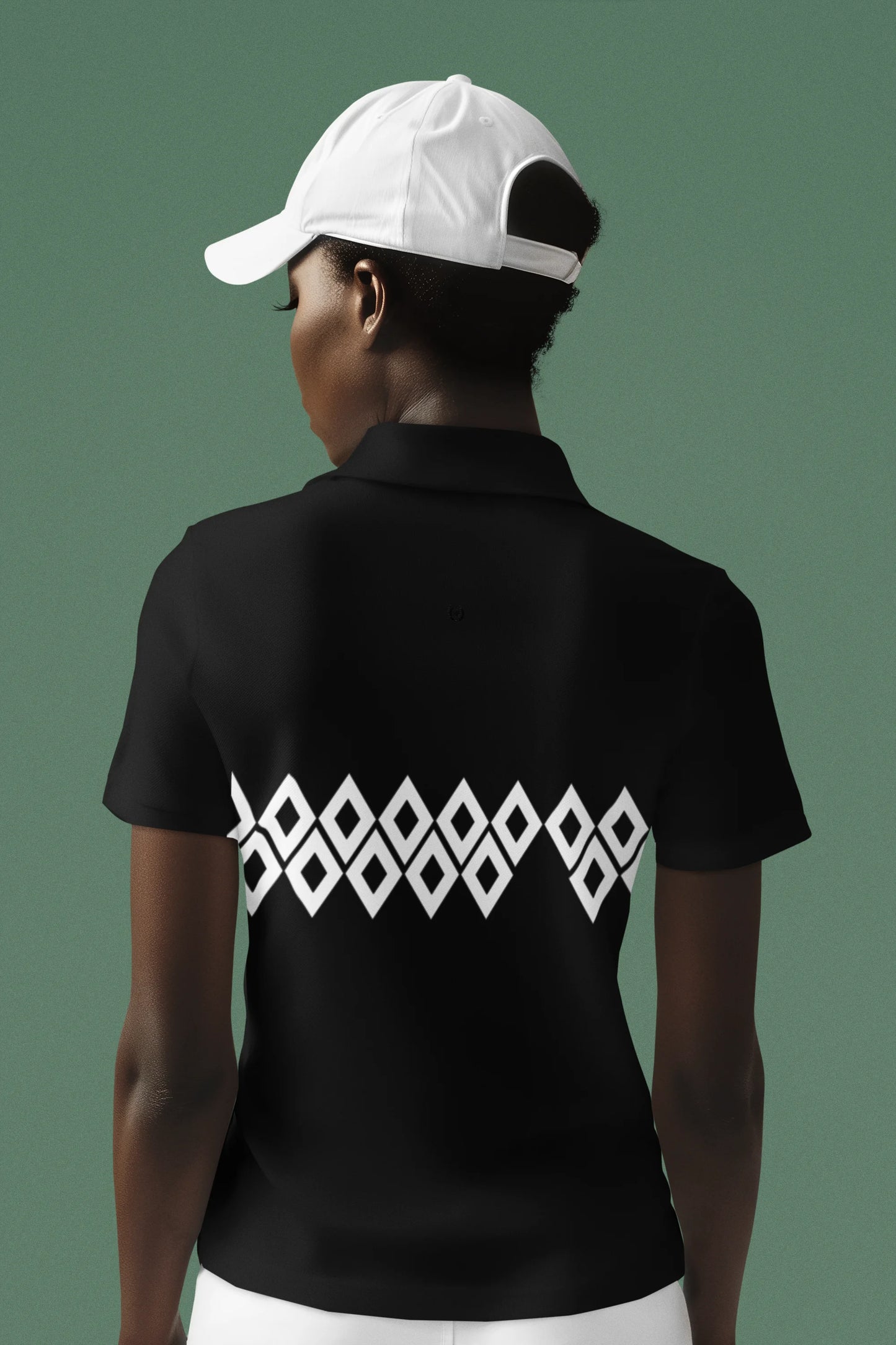 Person wearing a black polo shirt with a white geometric pattern on the back, against a dark green background.