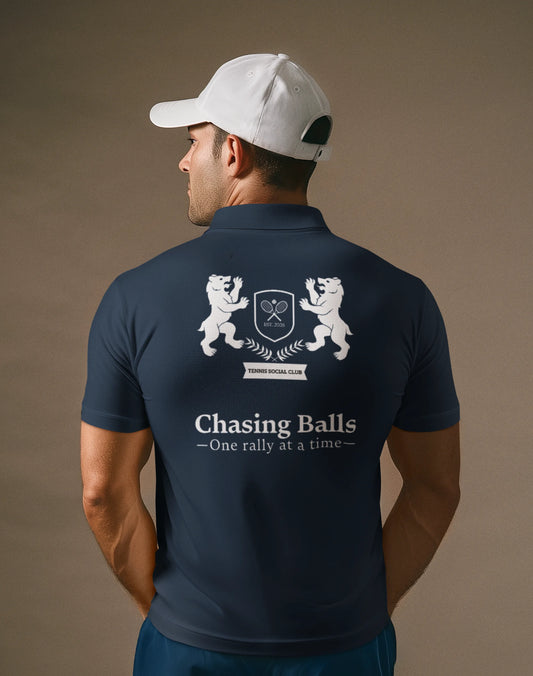 Man wearing a navy blue polo shirt with a logo and text on the back, on a brown background