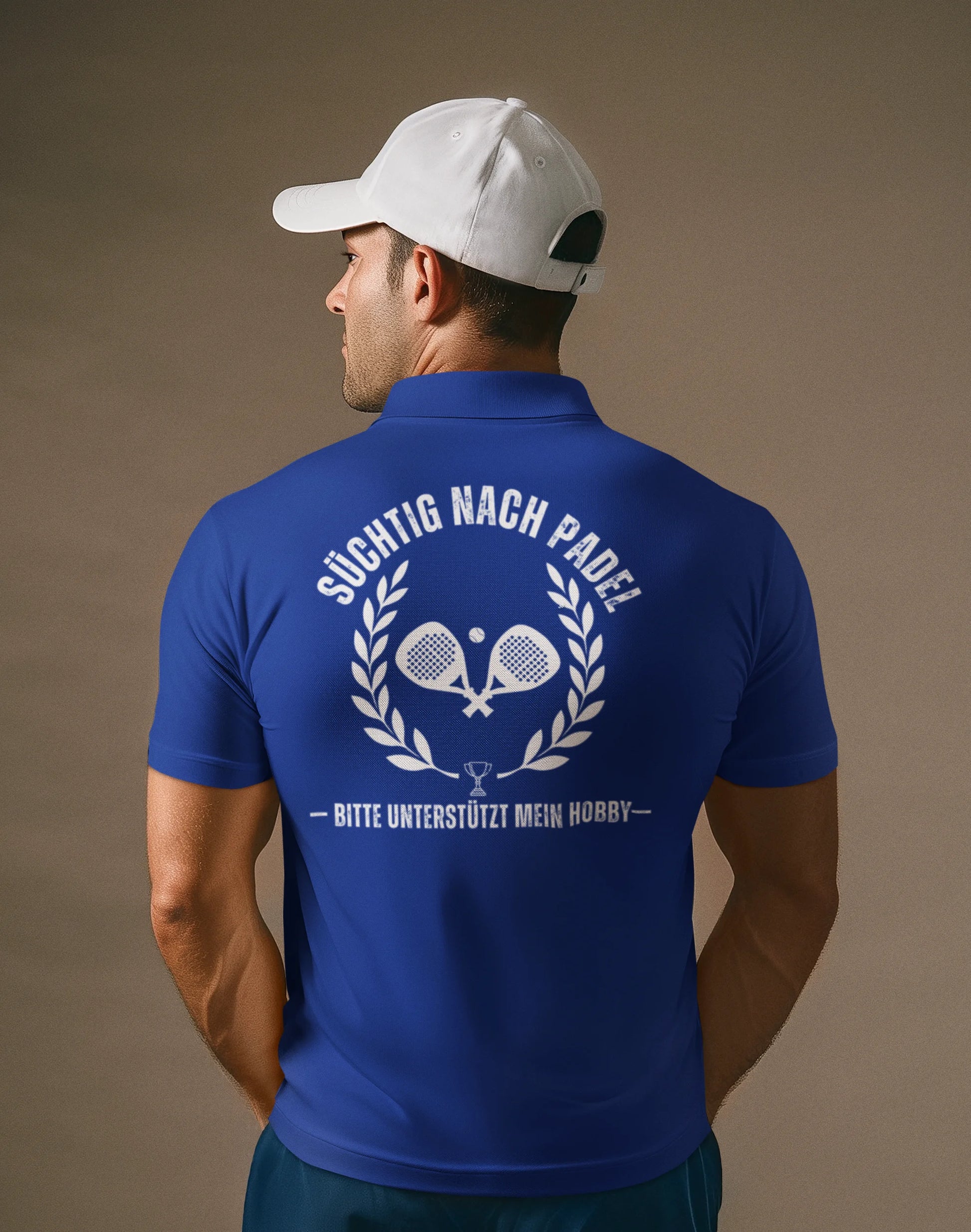 Man wearing a blue polo shirt with text and logo on the back against a brown background