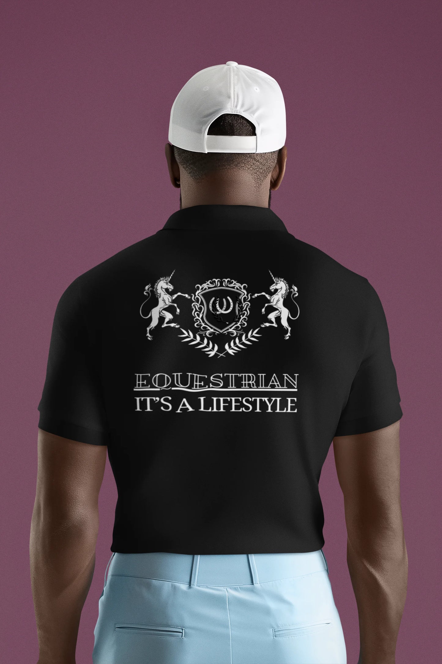 Man wearing a black polo shirt with 'Equestrian It's a Lifestyle' text and design on the back, against a purple background.