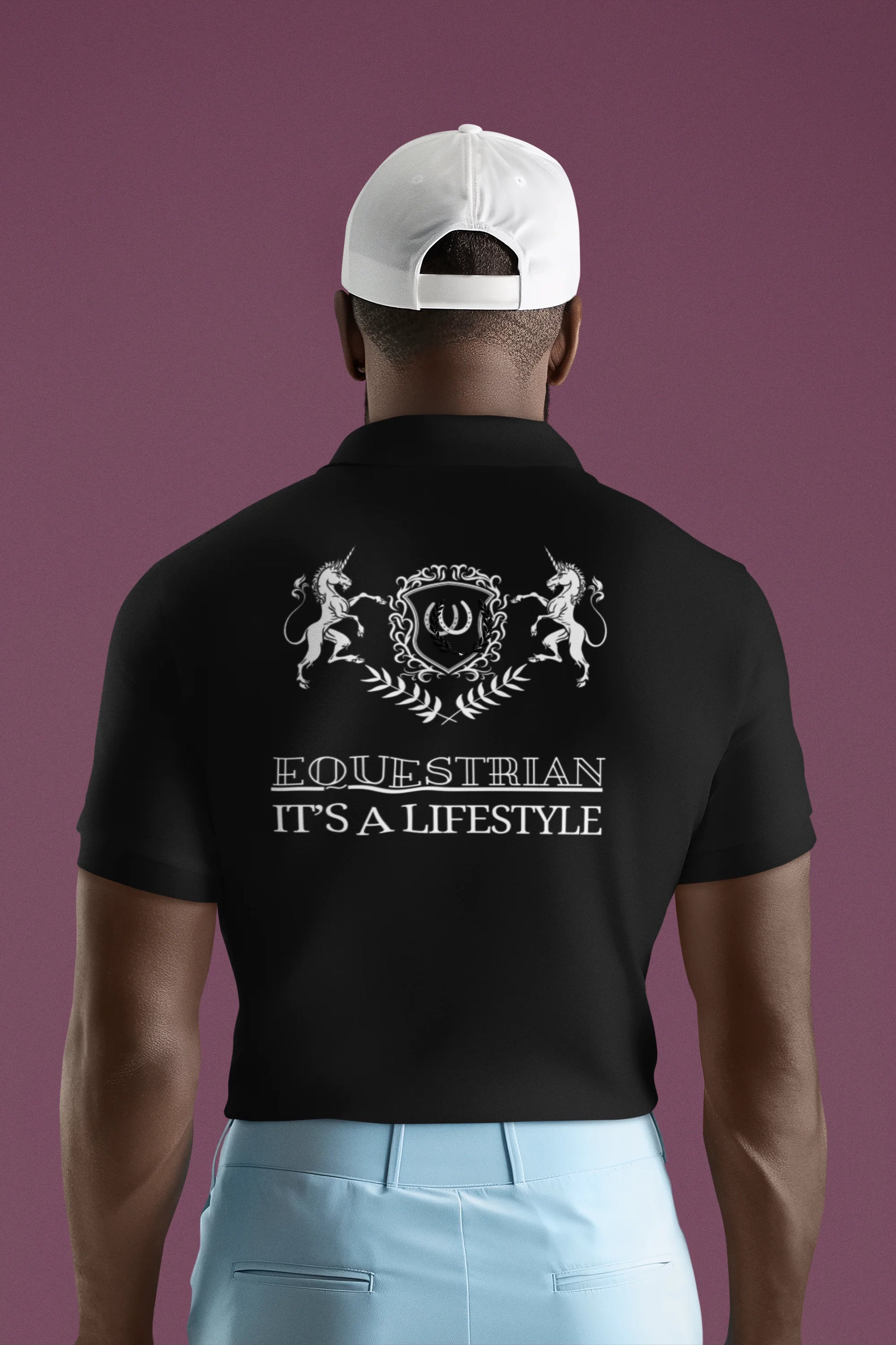Man wearing a black polo shirt with 'Equestrian It's a Lifestyle' text and design on the back, against a purple background.