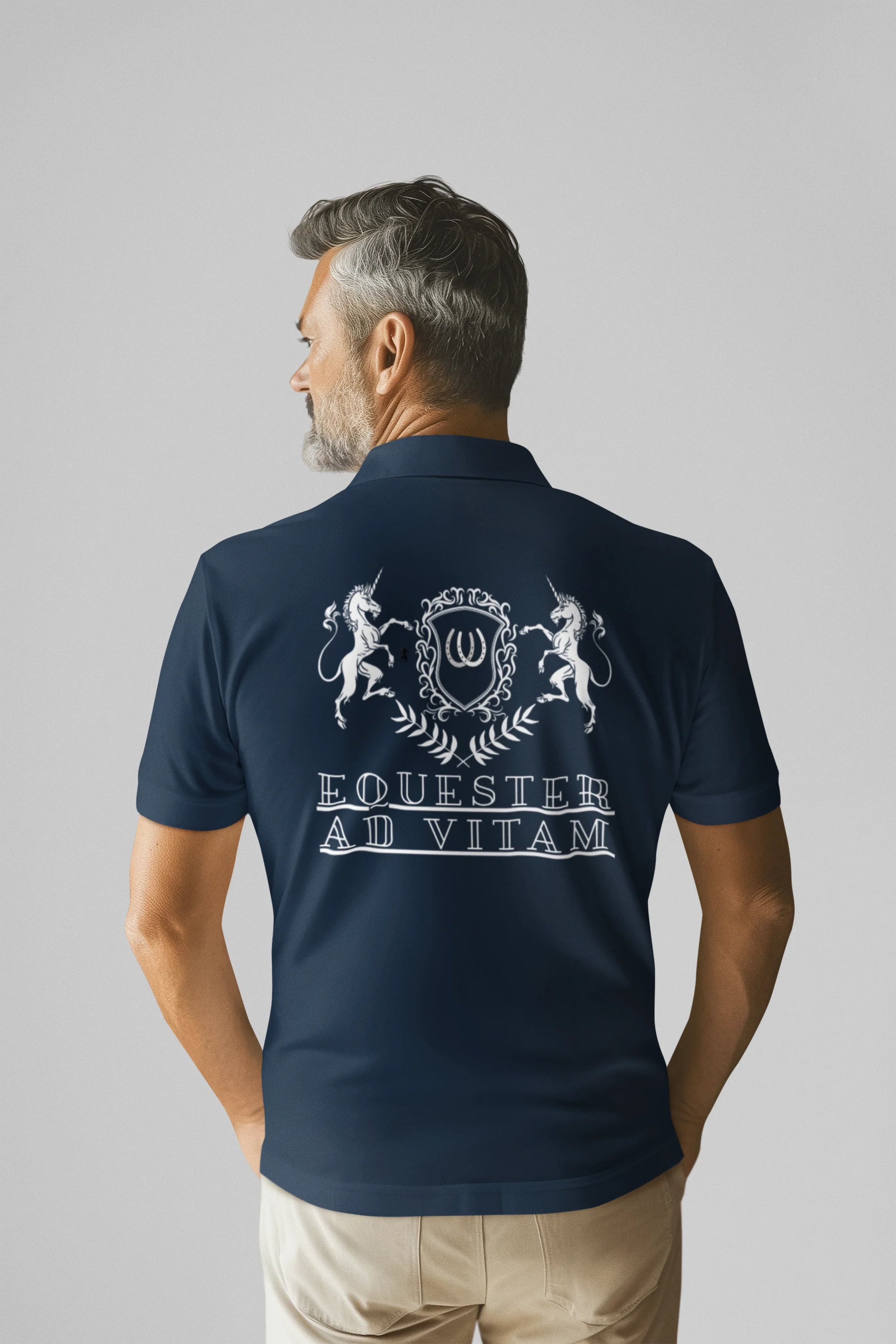 Man wearing a navy blue polo shirt with white text and design on the back, standing against a plain background.