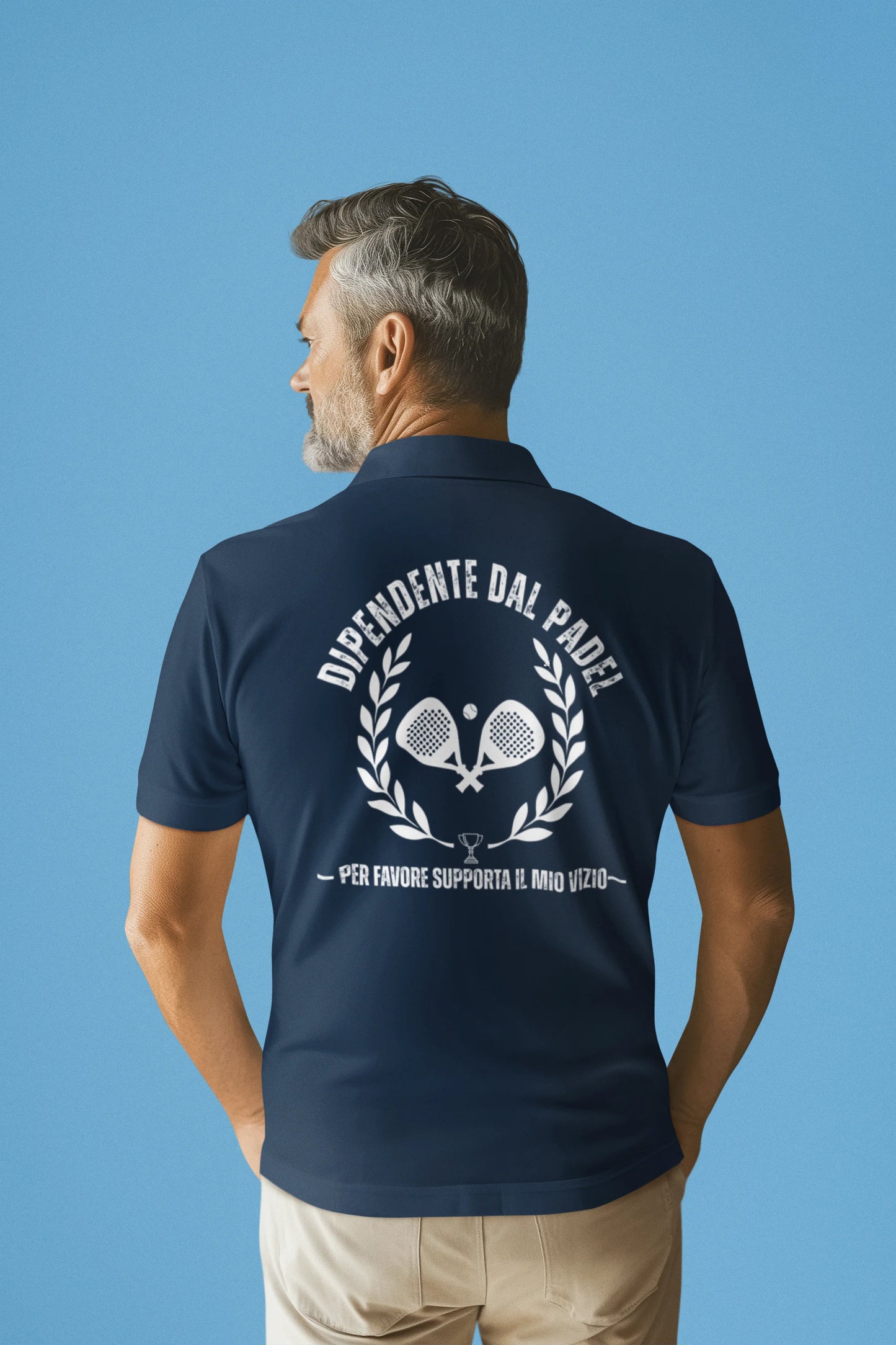 Man wearing a navy blue polo shirt with a logo and text on the back against a blue background