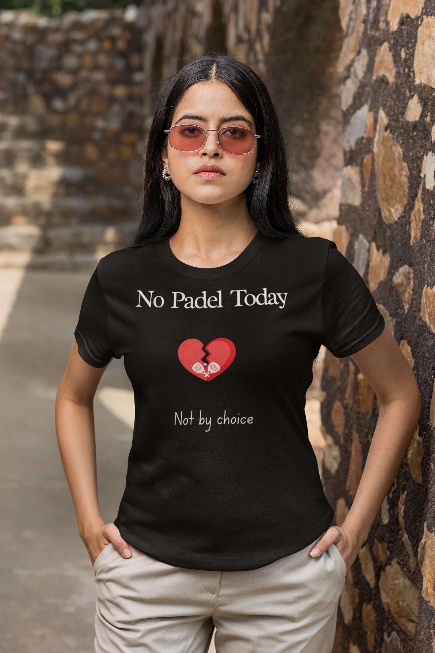 Padel Gift Woman wearing a black t-shirt with 'No Padel Today, Not by choice' text and a red heart symbol.