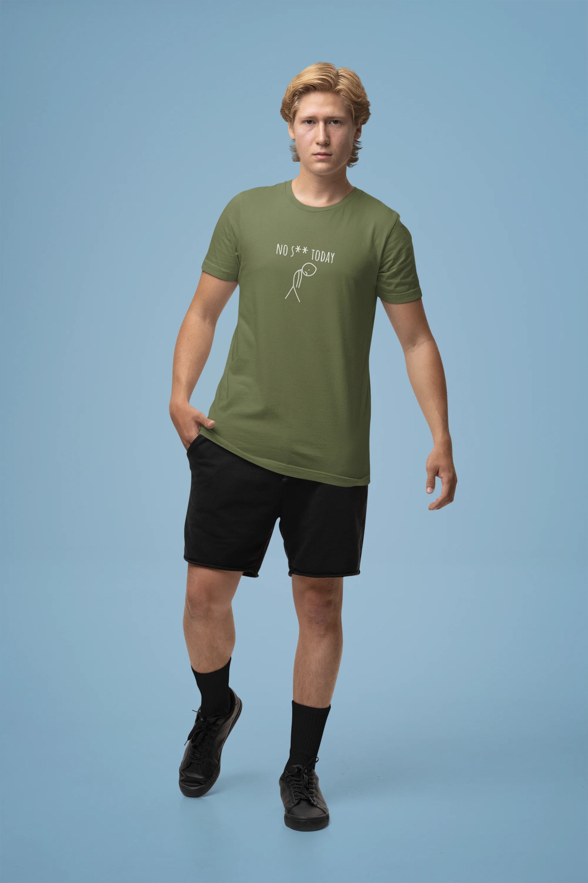 Man wearing a green t-shirt and black shorts on a blue background