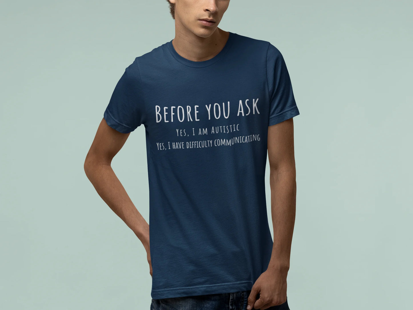 Person wearing a blue t-shirt with text on a light gray background