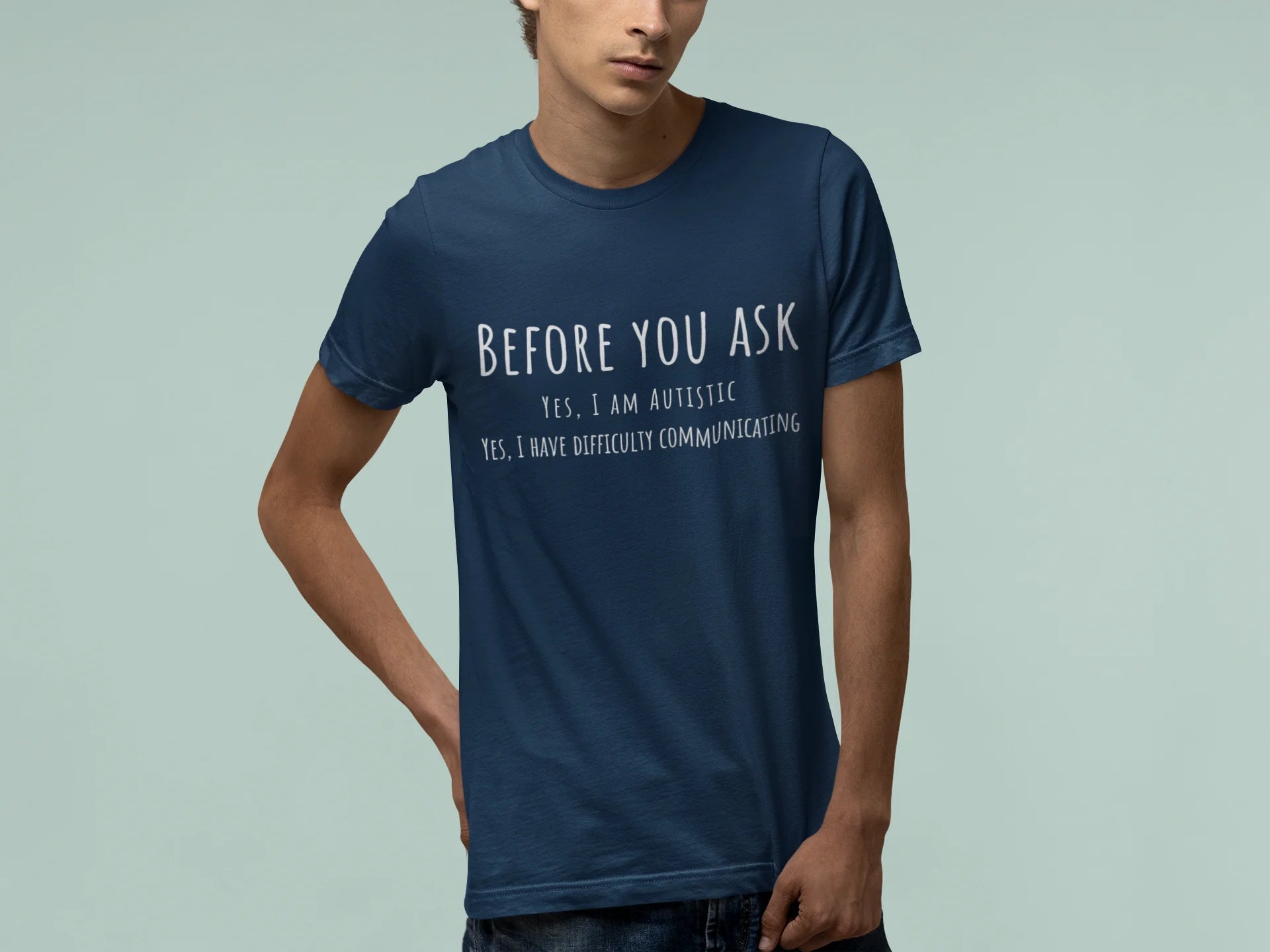 Person wearing a blue t-shirt with text on a light gray background
