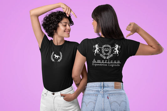 Two people wearing black t-shirts with logos on a pink background