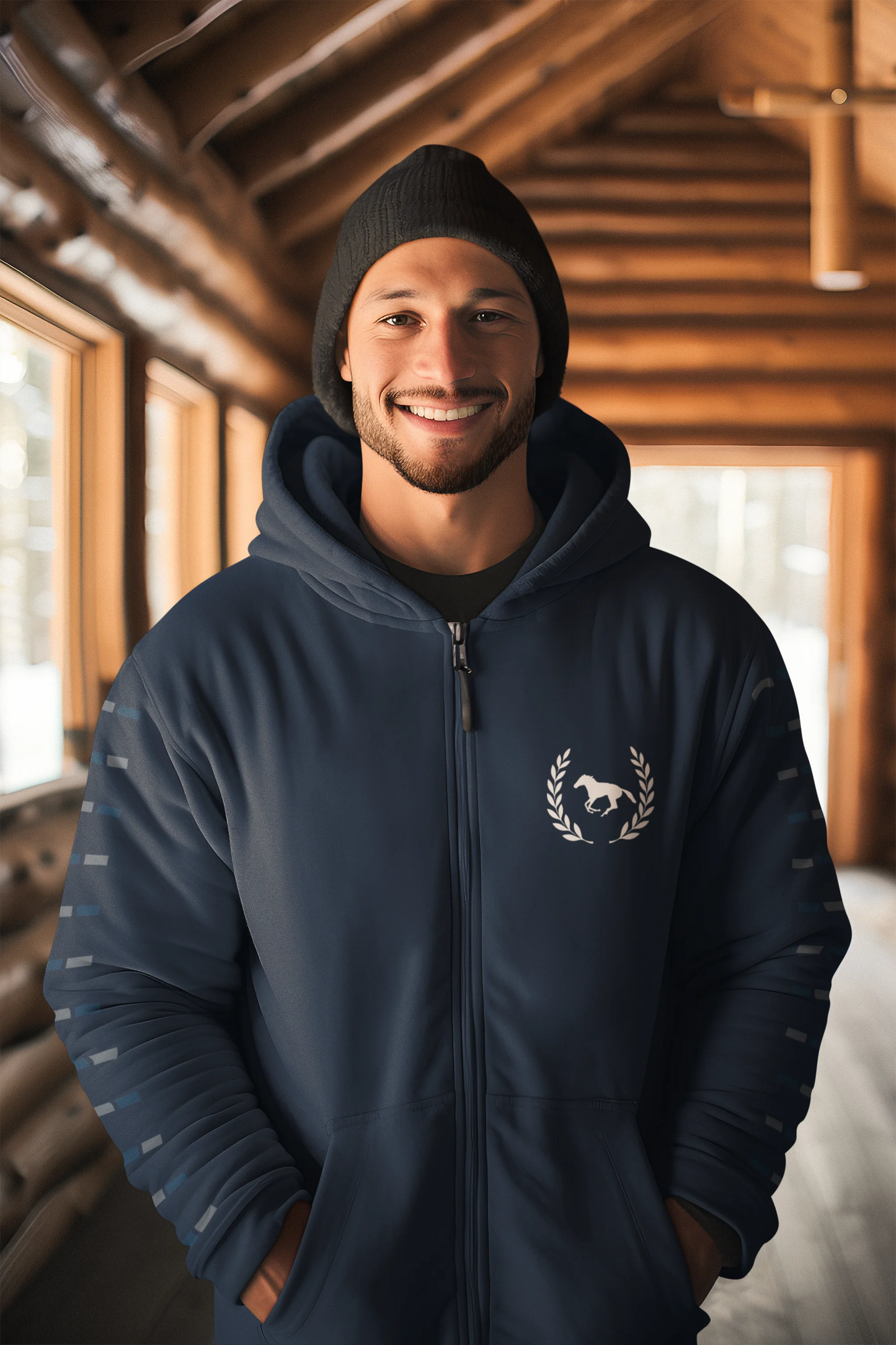 Man wearing a navy blue hoodie with a logo indoors