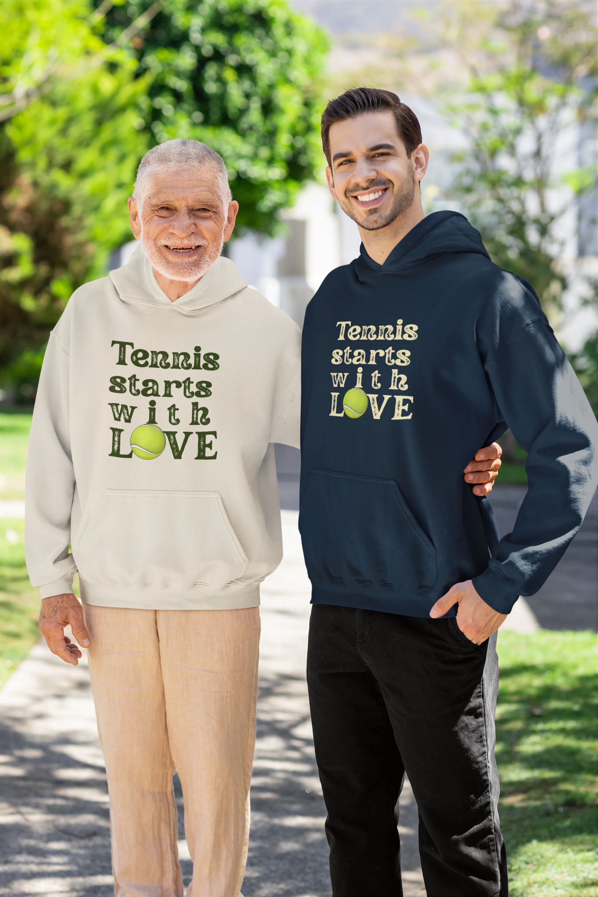 Two people wearing hoodies with 'Tennis starts with LOVE' text outdoors.
