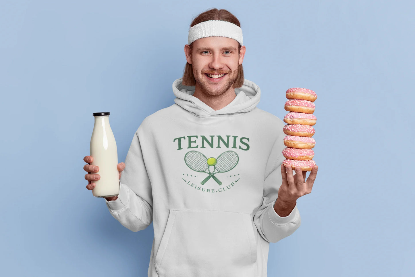 Person wearing a hoodie with 'Tennis' text holding a bottle and donuts against a light blue background