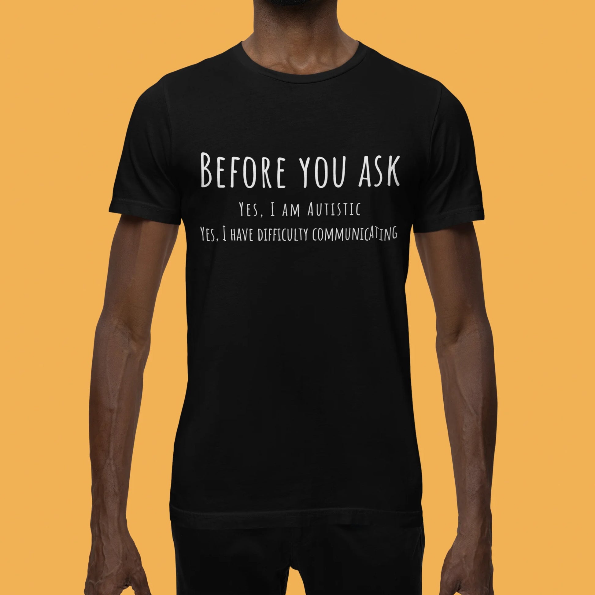Black t-shirt with white text on a mustard yellow background