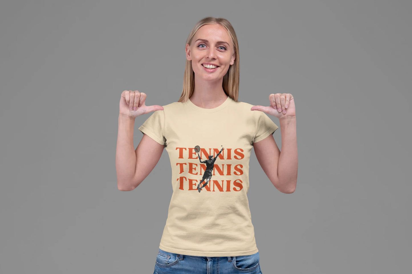 Woman wearing a beige t-shirt with 'Tennis Tennis Tennis' and a tennis player graphic on a gray background
