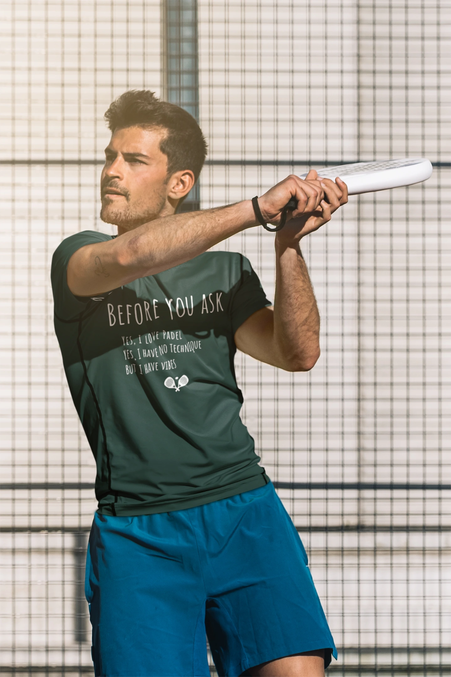 Man playing tennis with a racket on a tennis court