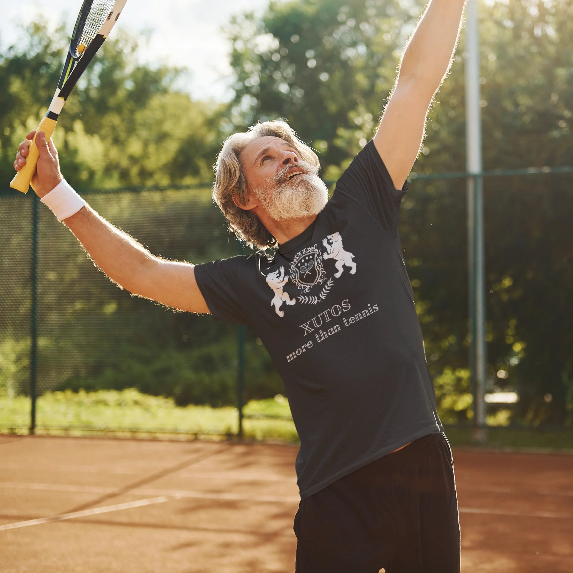 Xutos More than tennis Man playing tennis on a court with trees in the background