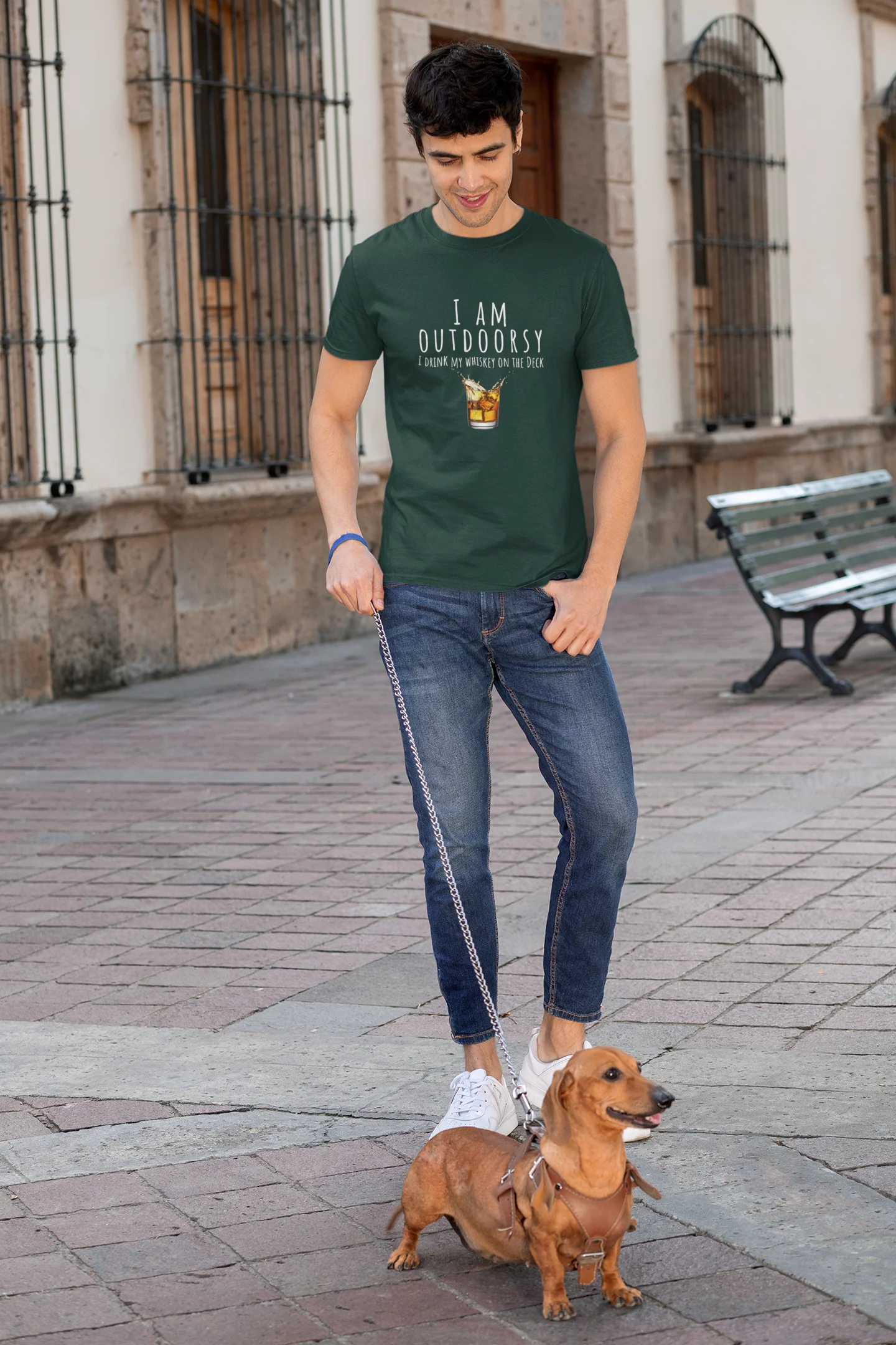 Man walking a dog on a leash in an urban setting