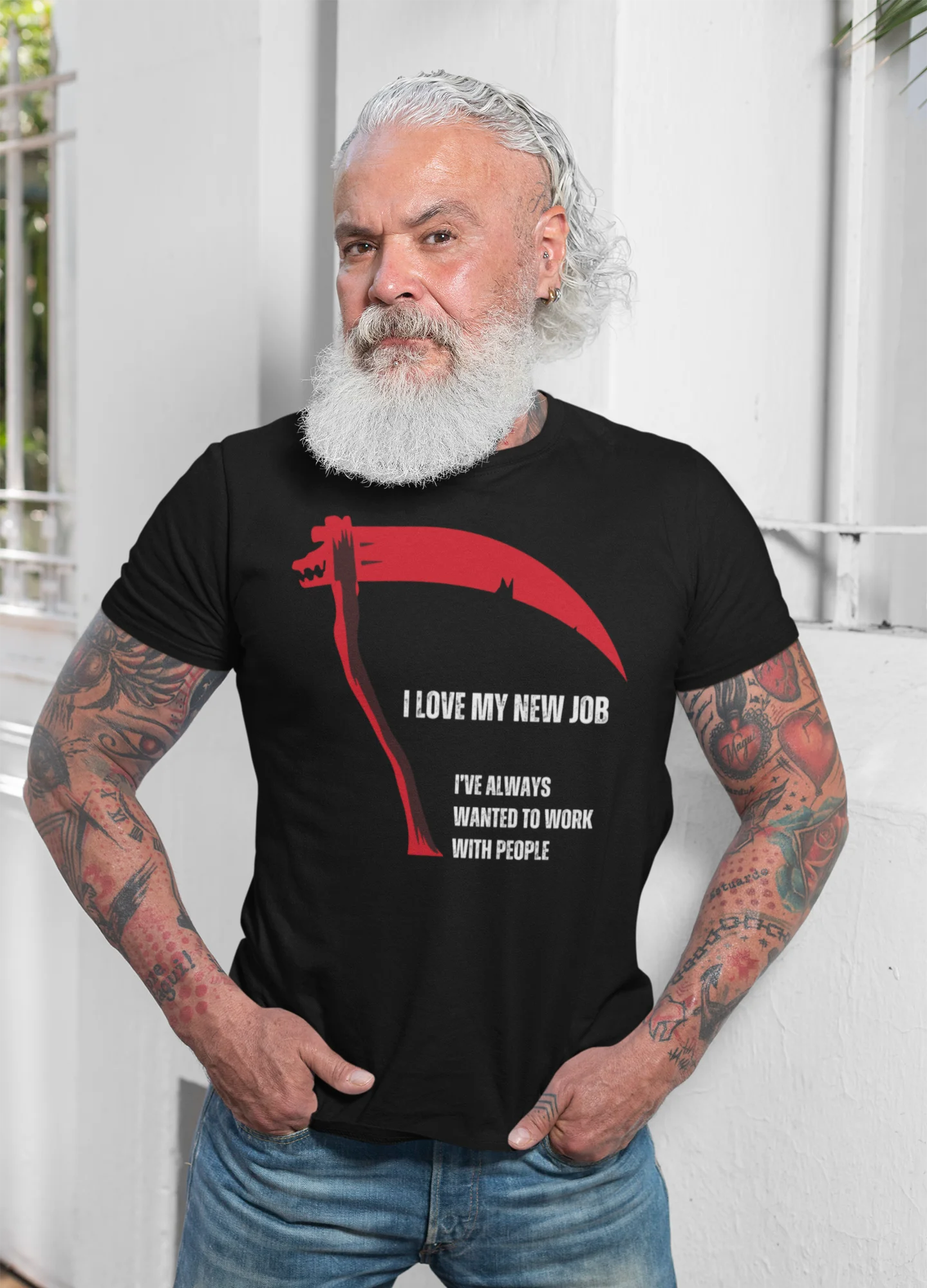 Man wearing a black t-shirt with a graphic and text, standing against a white background.