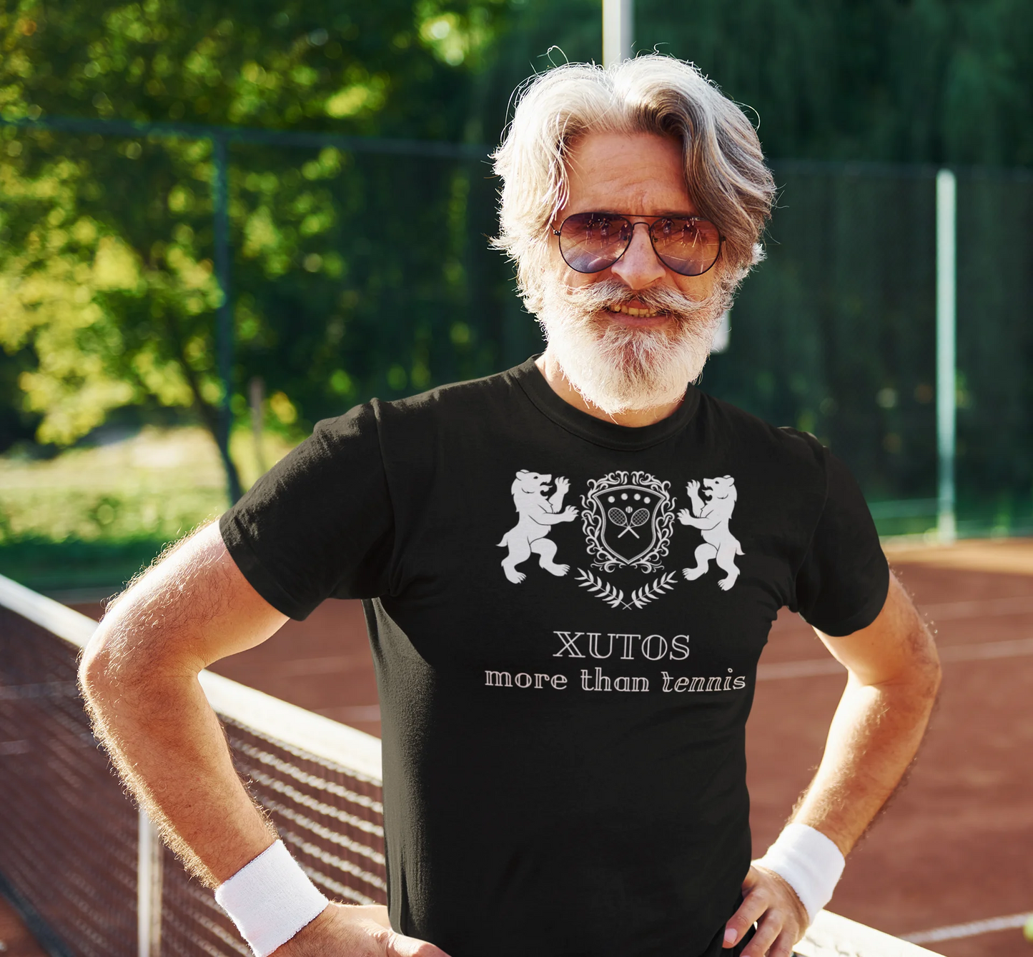 Xutos More than tennis Man wearing a black t-shirt with a logo and text on a tennis shirt