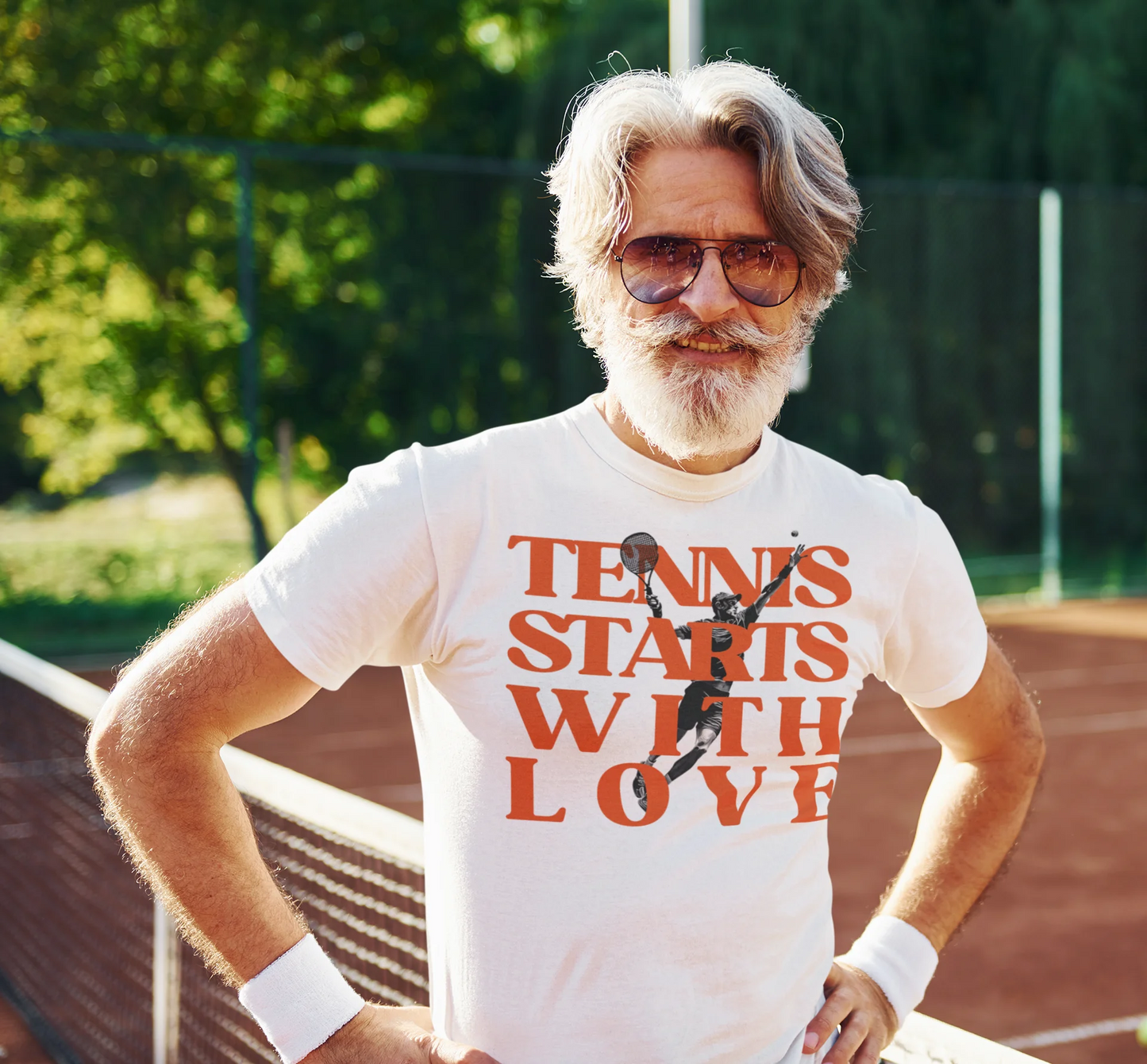Tennis lover Shirt Man wearing a t-shirt with 'Tennis Starts With Love' on a tennis court