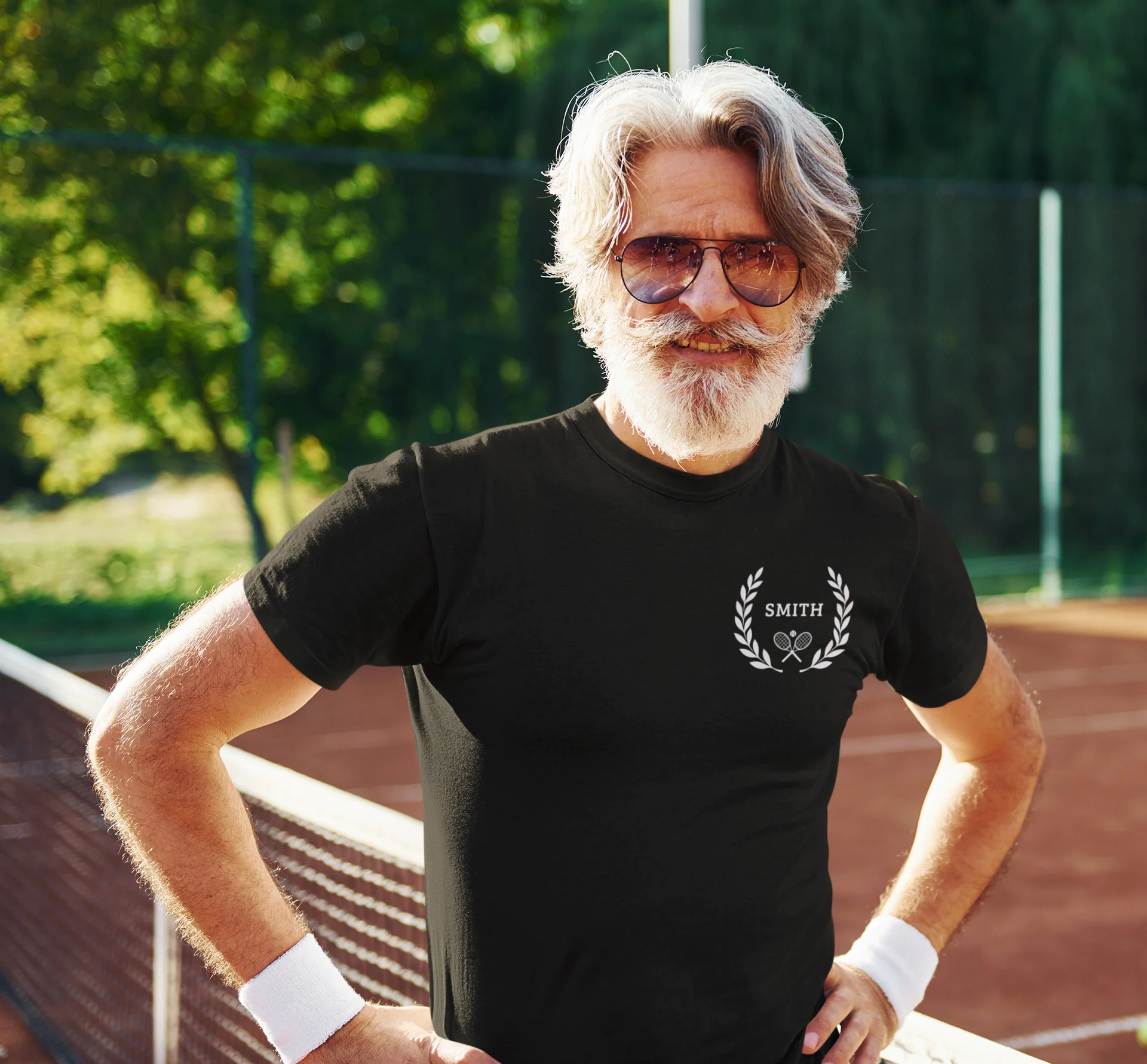 Unique gifts for tennis players Man wearing a black t-shirt with a logo on a tennis court