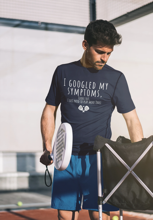 Man holding a tennis racket and wearing a t-shirt with humorous text on a tennis court.