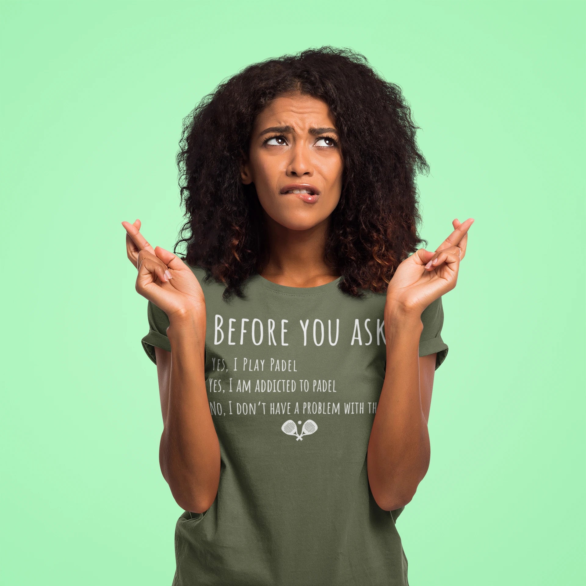 Woman wearing a green t-shirt with text on a light green background