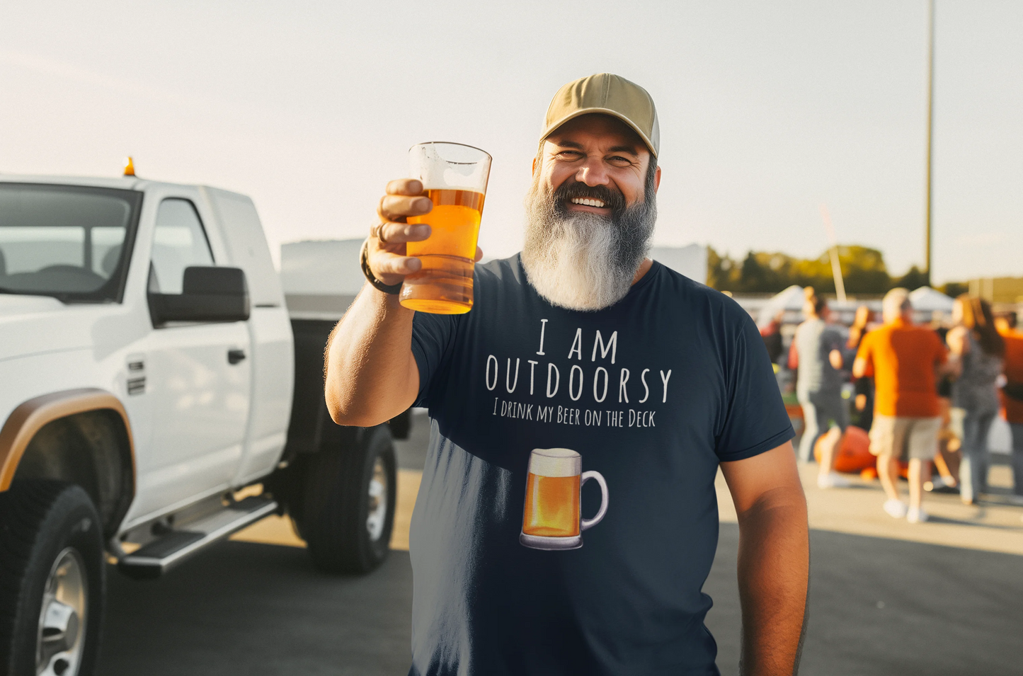 Man holding a beer and wearing an 'I am Outdoorsy' t-shirt in a parking lot.