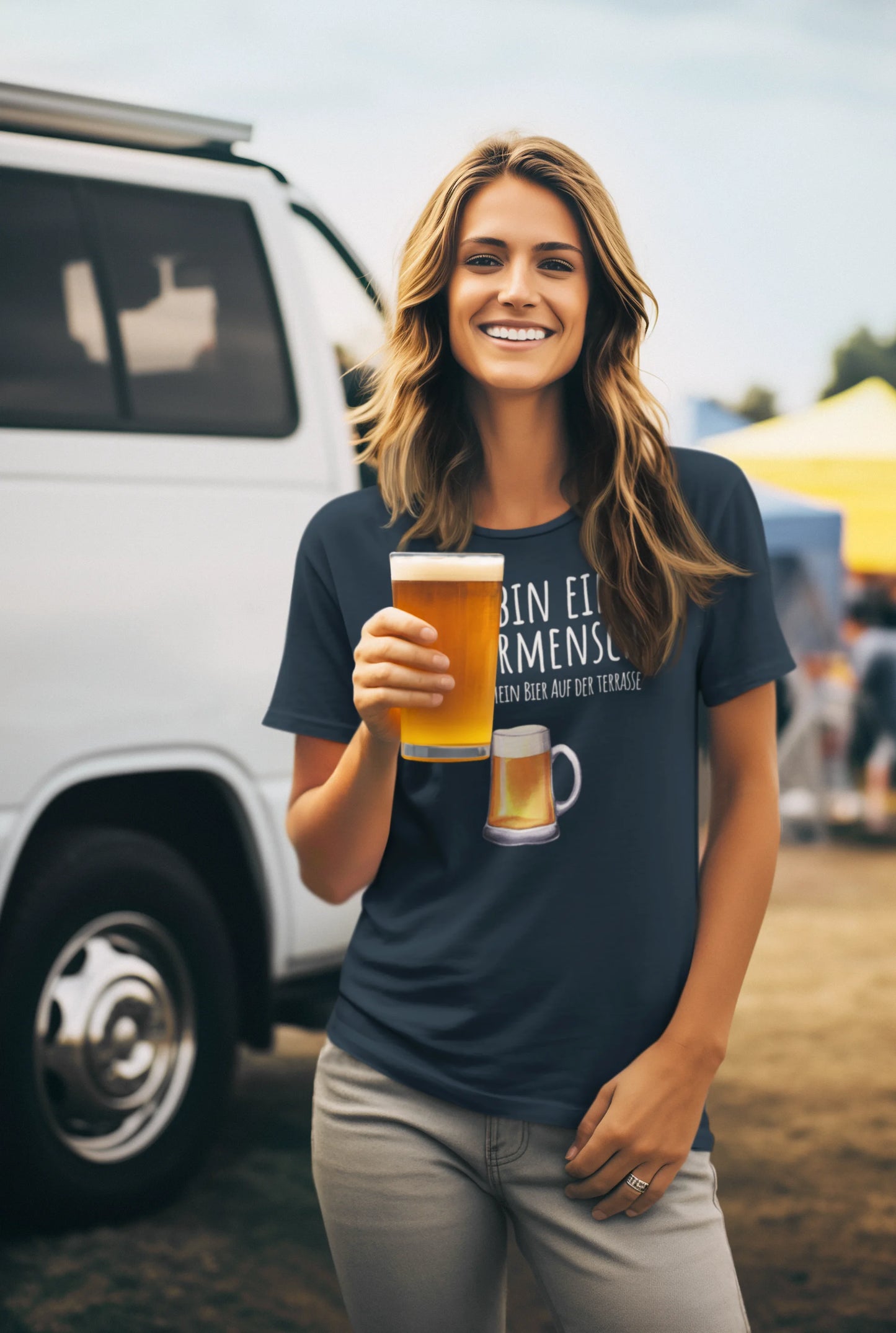 Woman holding a beer mug outdoors with a van and yellow umbrella in the background