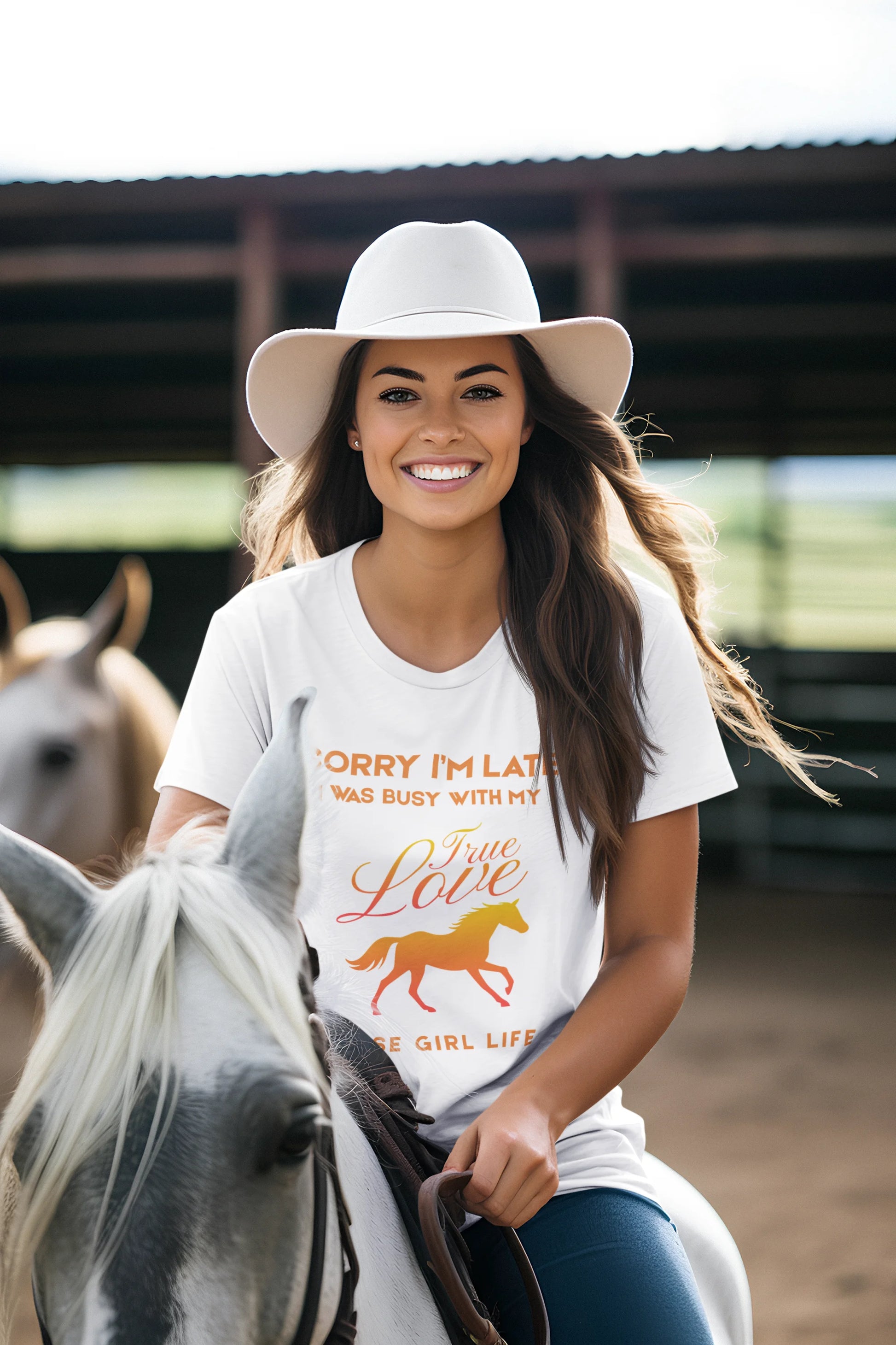 Woman riding a horse wearing a white t-shirt with a graphic and text.