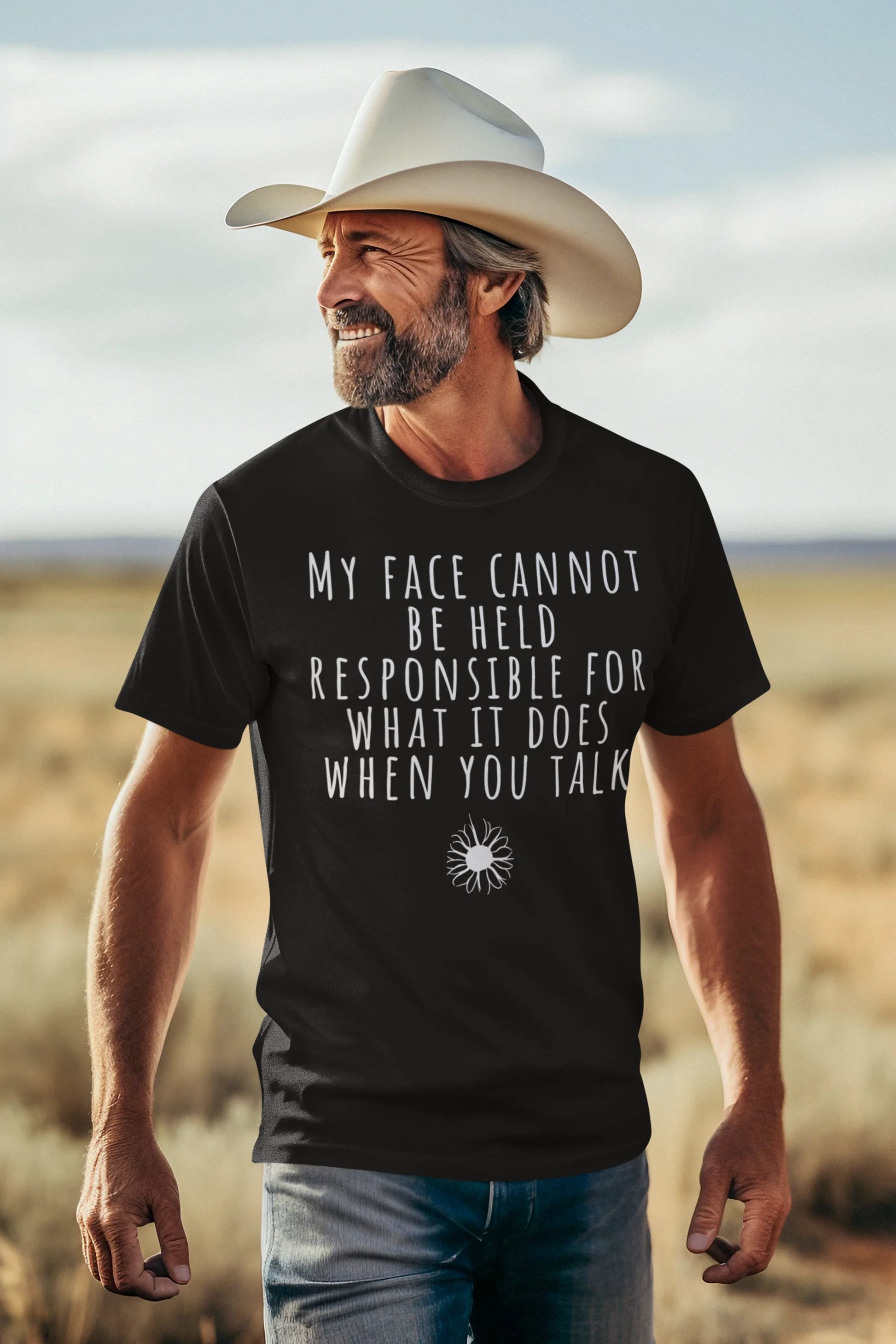Man wearing a black t-shirt with a humorous quote in a desert setting