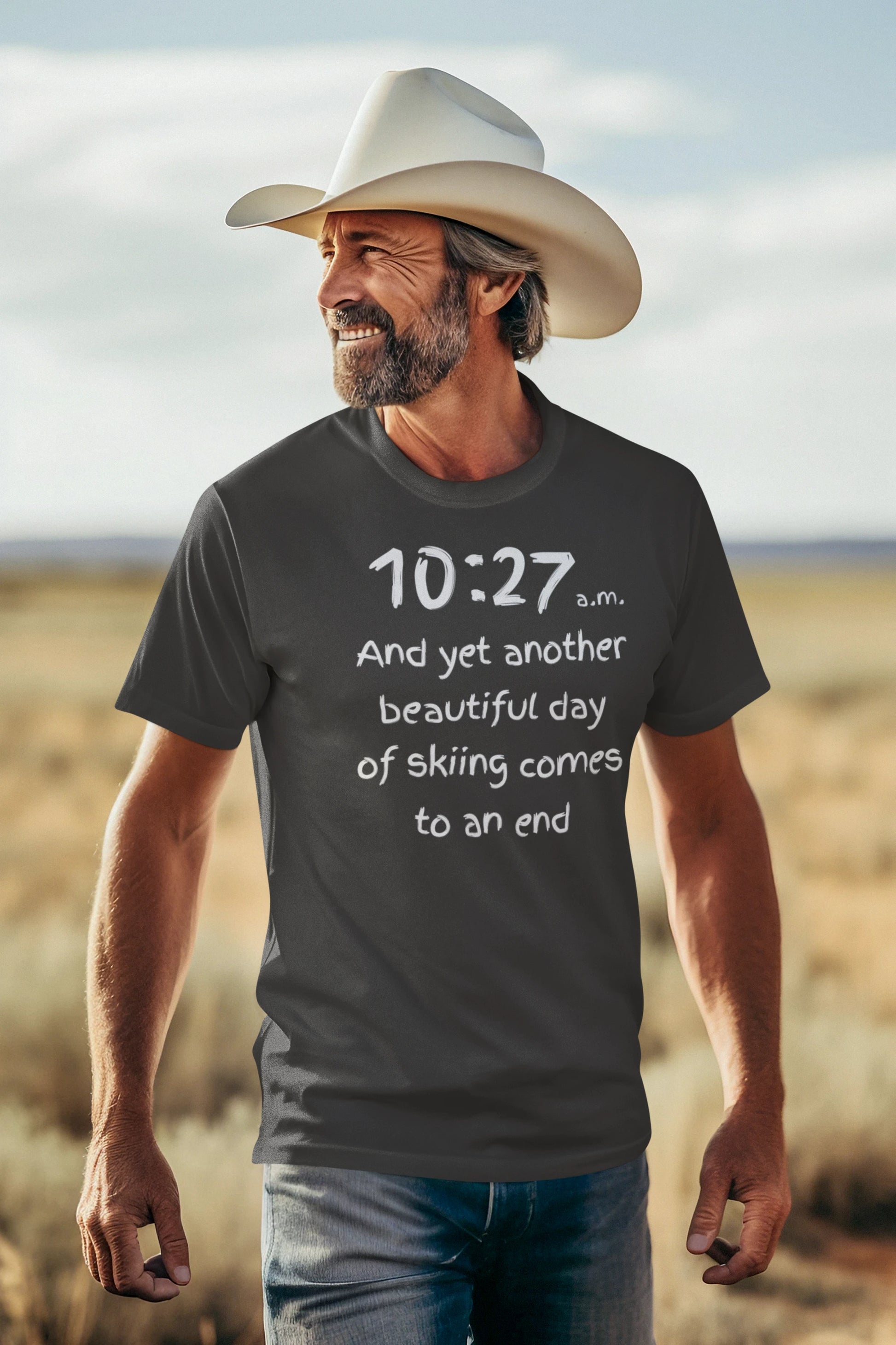 Man wearing a gray t-shirt with text in a desert setting