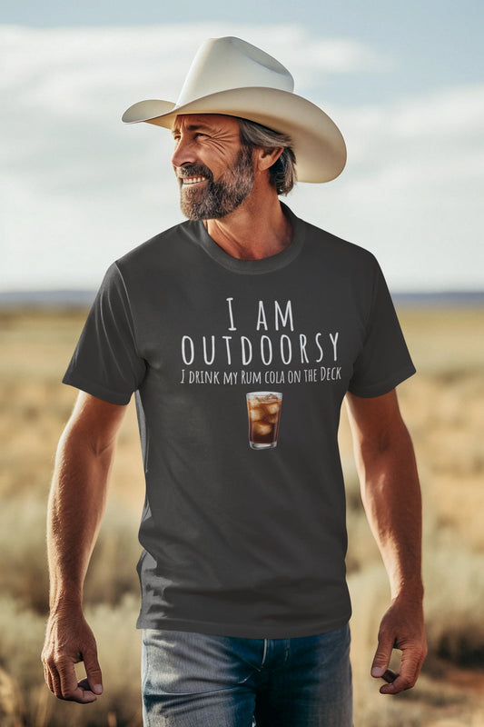 Man wearing a cowboy hat and t-shirt with humorous text in a desert setting