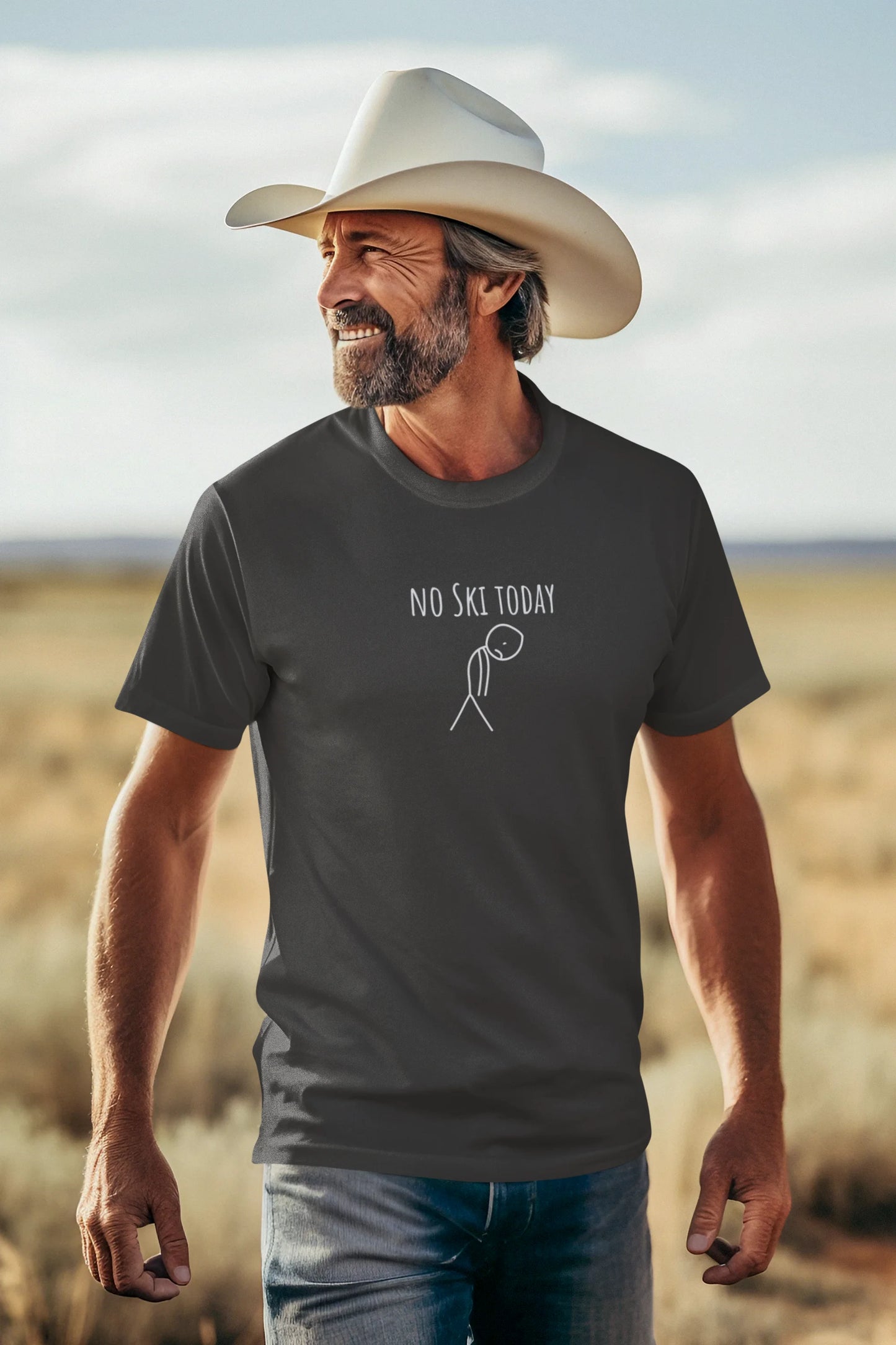 Man wearing a cowboy hat and t-shirt with 'No Ski Today' graphic in a desert setting