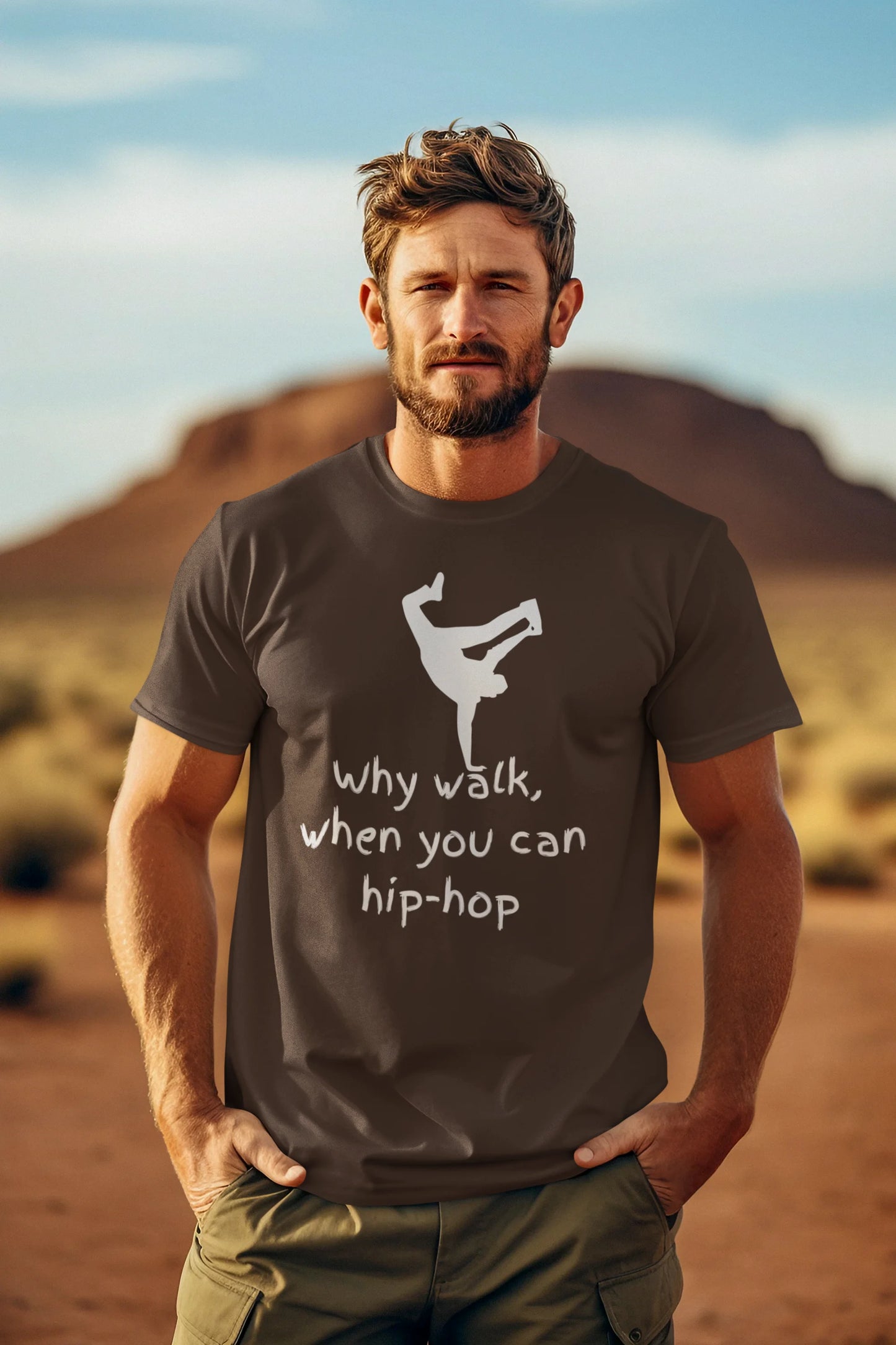 Man wearing a t-shirt with a graphic and text in a desert setting
